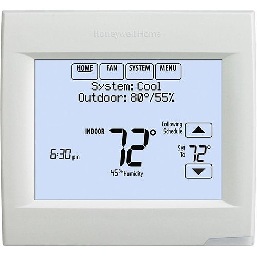 Honeywell Home VisionPRO 8000 WiFi programmable thermostat mounted on wall showing digital display and control buttons.