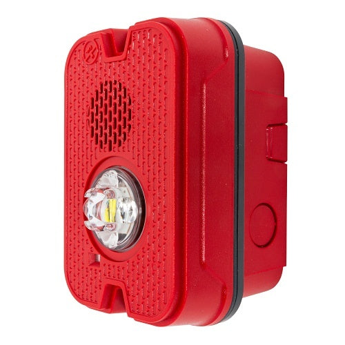 Red System Sensor P2GRKLED-P compact wall-mounted horn strobe fire alarm with plain design, mounted on a wall.