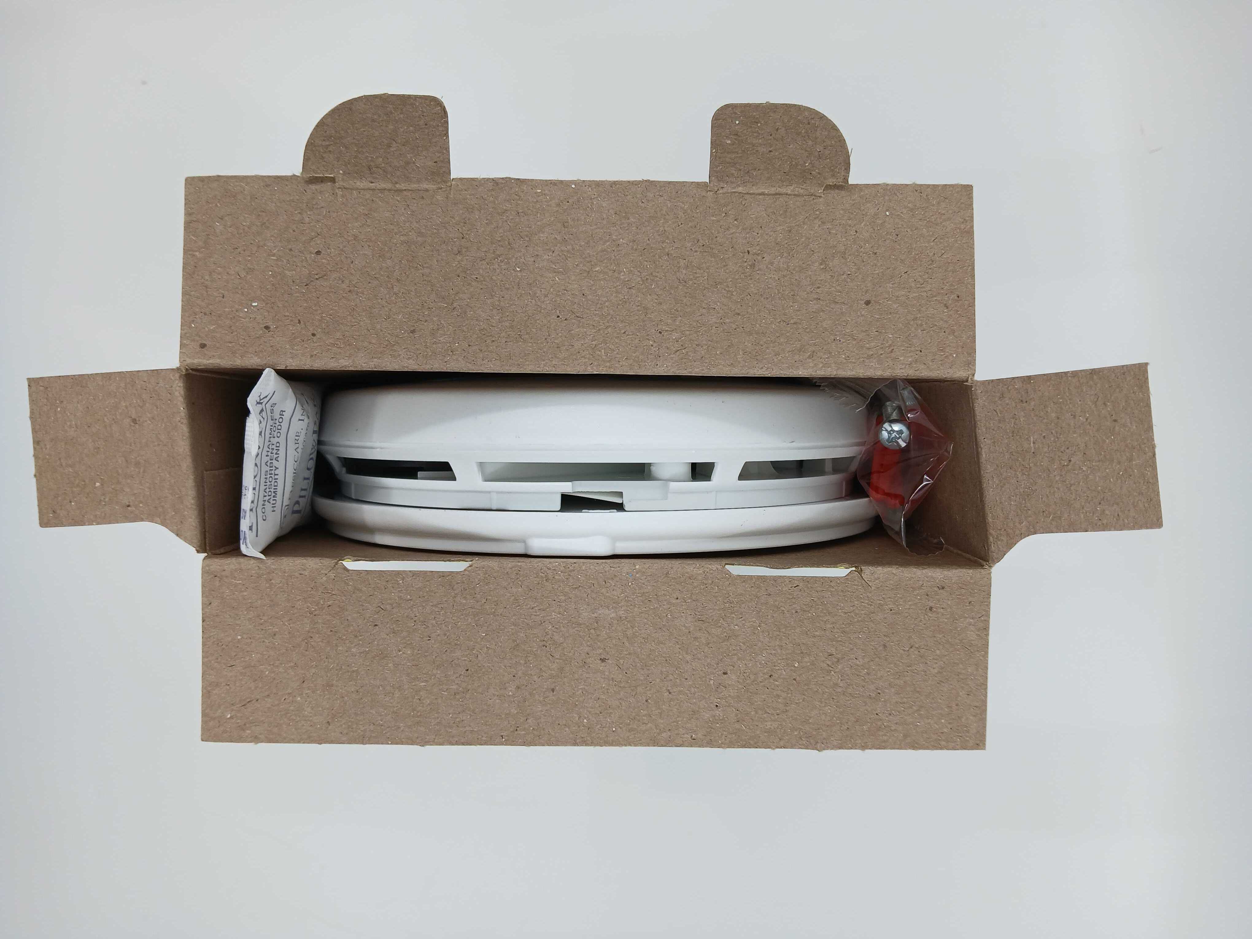 BRK SMCO210V 10-year sealed battery smoke alarm with combo alarm design, mounted on a ceiling for fire safety detection.