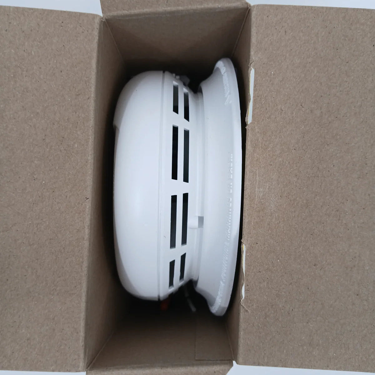 BRK SMCO100V-AC hardwired smoke and carbon monoxide detector showing the device with test and alarm indicators.