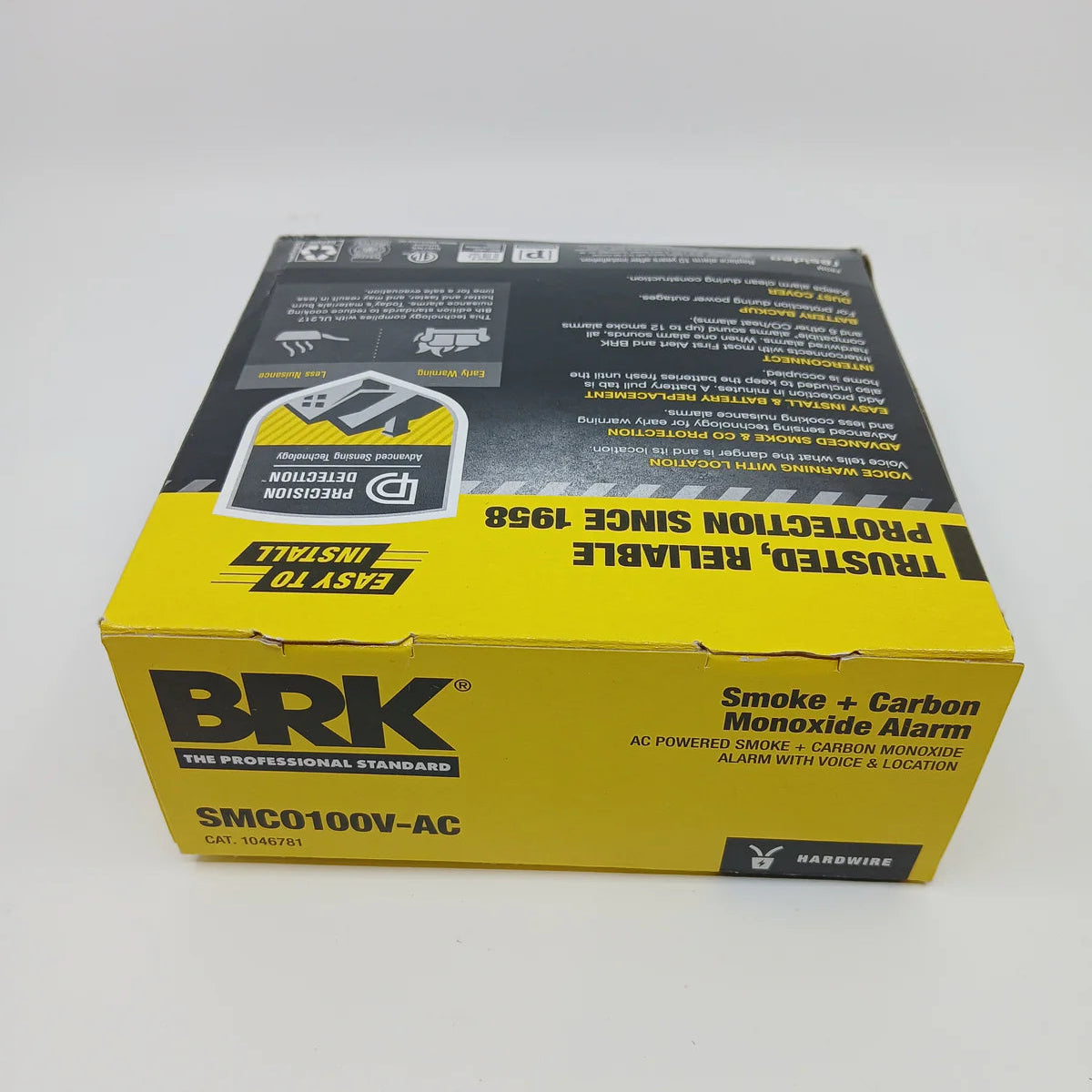 BRK SMCO100V-AC hardwired smoke and carbon monoxide alarm with interconnect feature, mounted on ceiling.