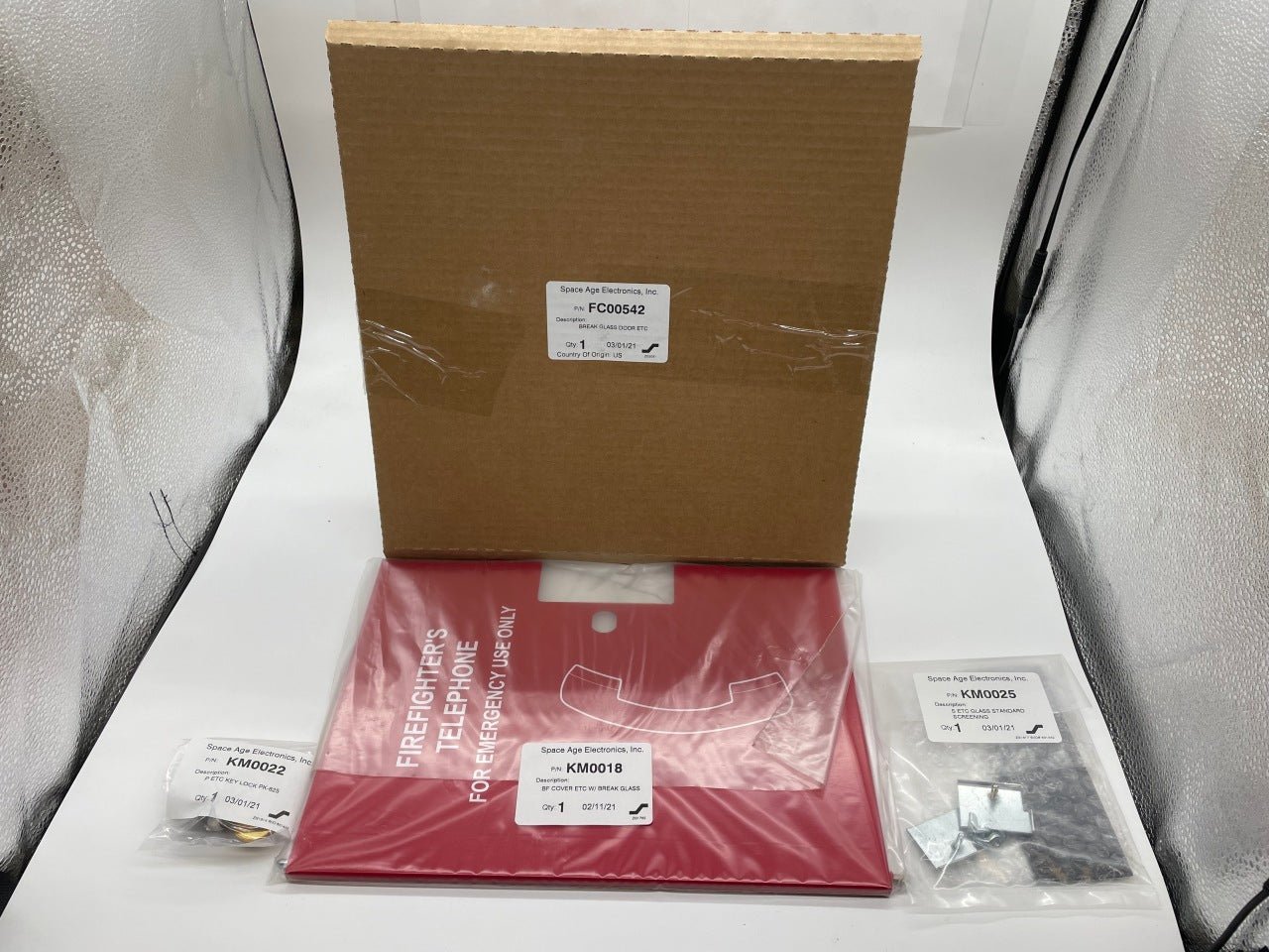 Space Age FC00542 break glass fire alarm with clear glass door and emergency activation button for safety alert.