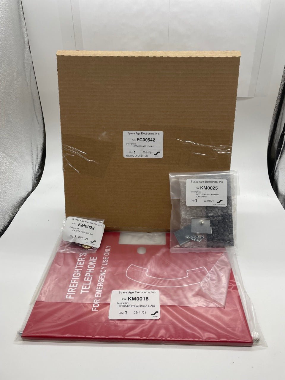 Space Age FC00542 fire alarm with break glass door for emergency use, mounted on wall in safety installation.