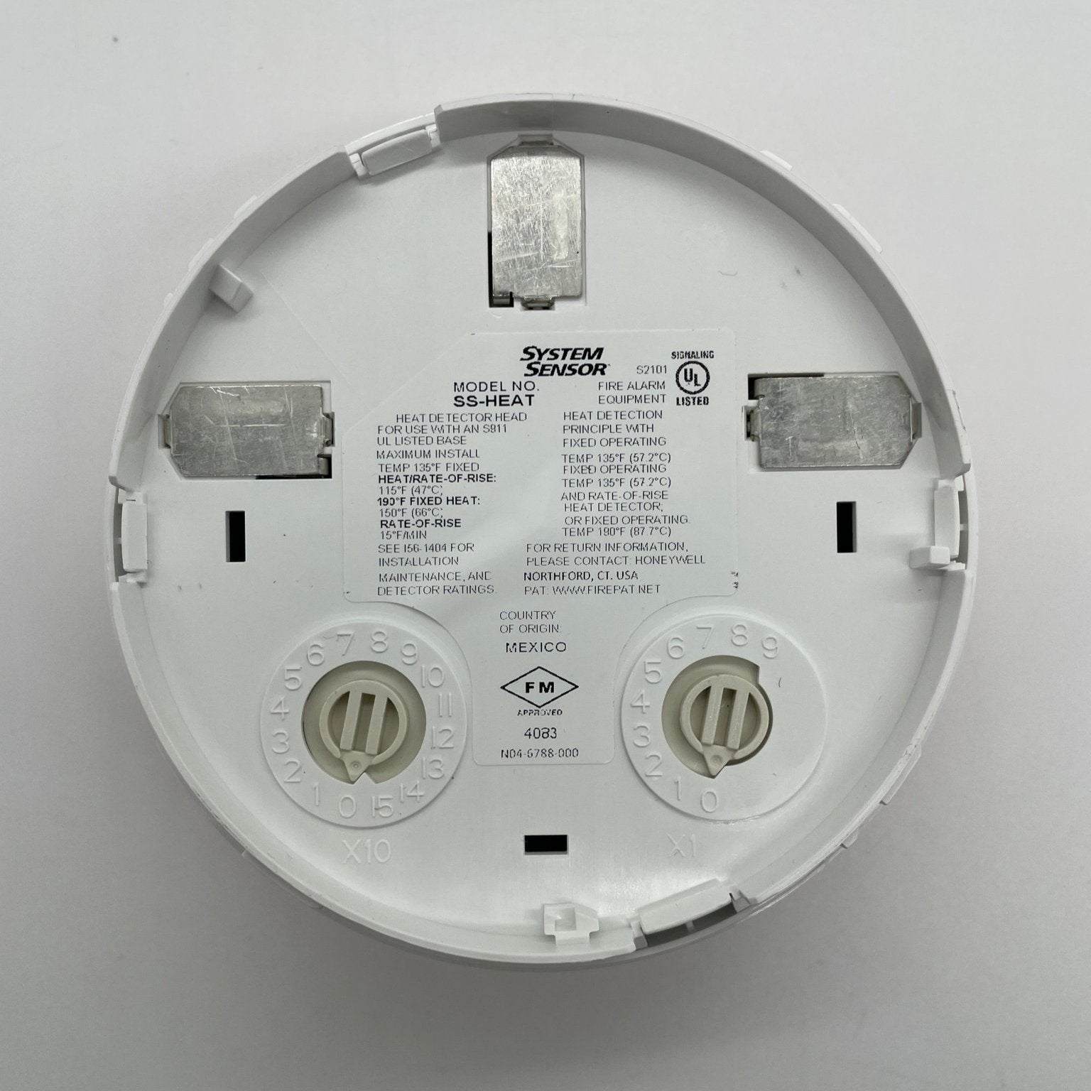System Sensor SS-HEAT fixed thermal detector showing a compact white thermal sensor for fire detection.