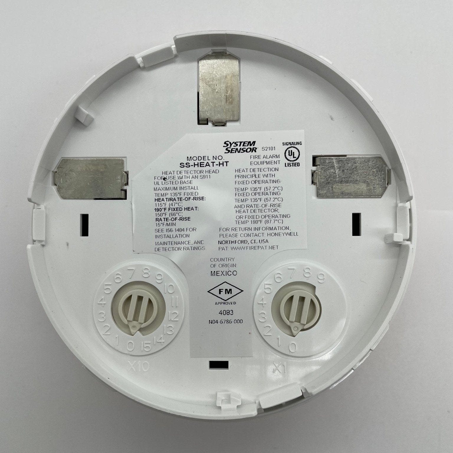 System Sensor SS-HEAT-HT thermal detector showing a compact, wall-mounted design for heat detection in fire safety systems.