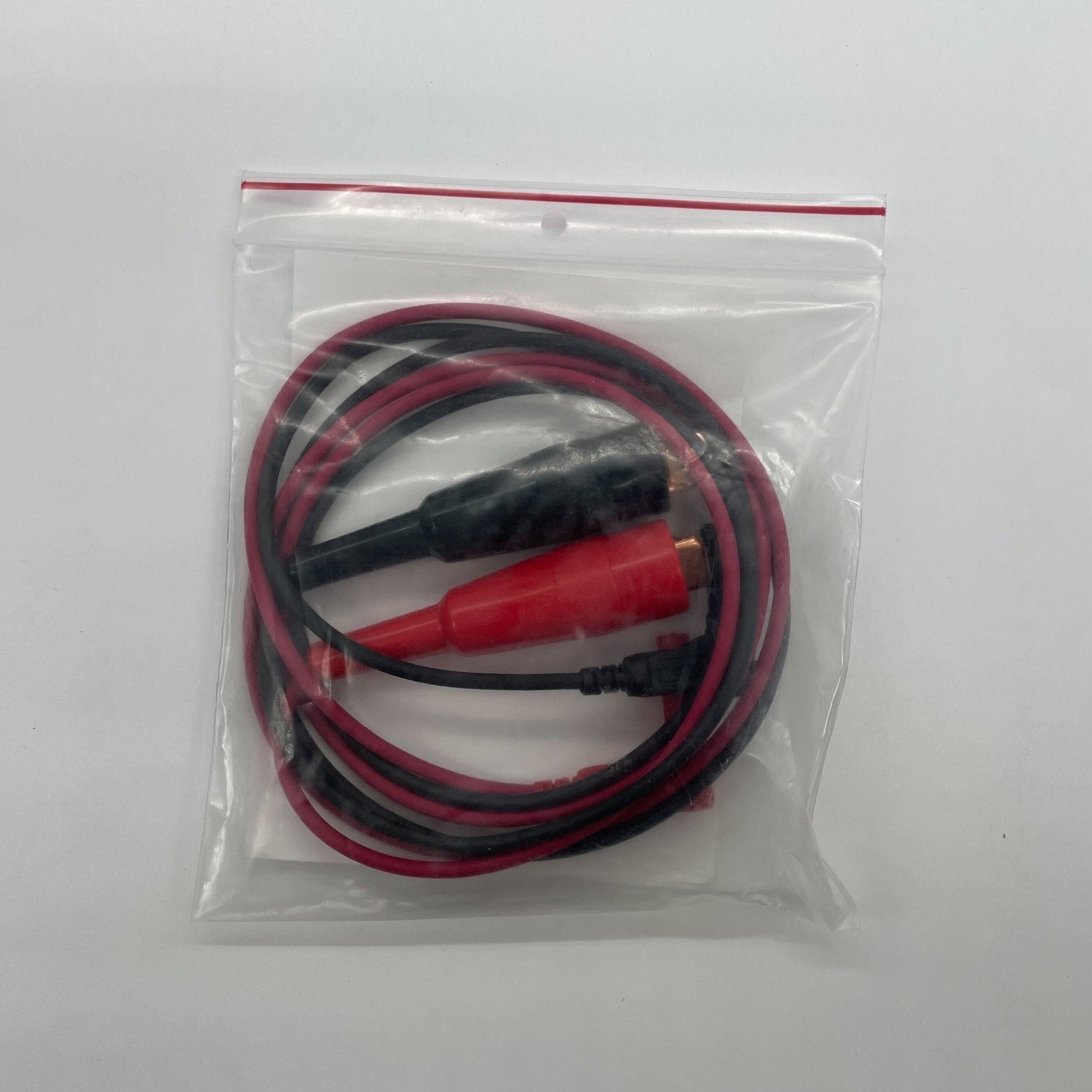 DetectorTesters CELL01RL fire alarm with regular leads, visible in the image, showcasing its compact design and connection terminals.