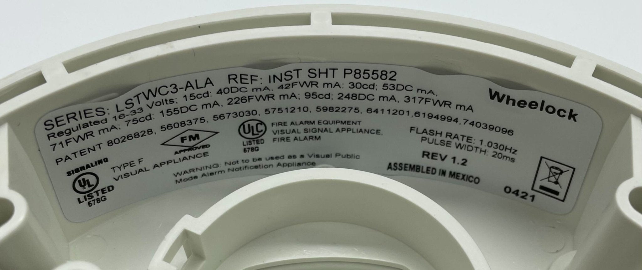 Eaton Wheelock Exceder LED3 Strobe light with clear lens and mounting bracket, designed for emergency warning systems.