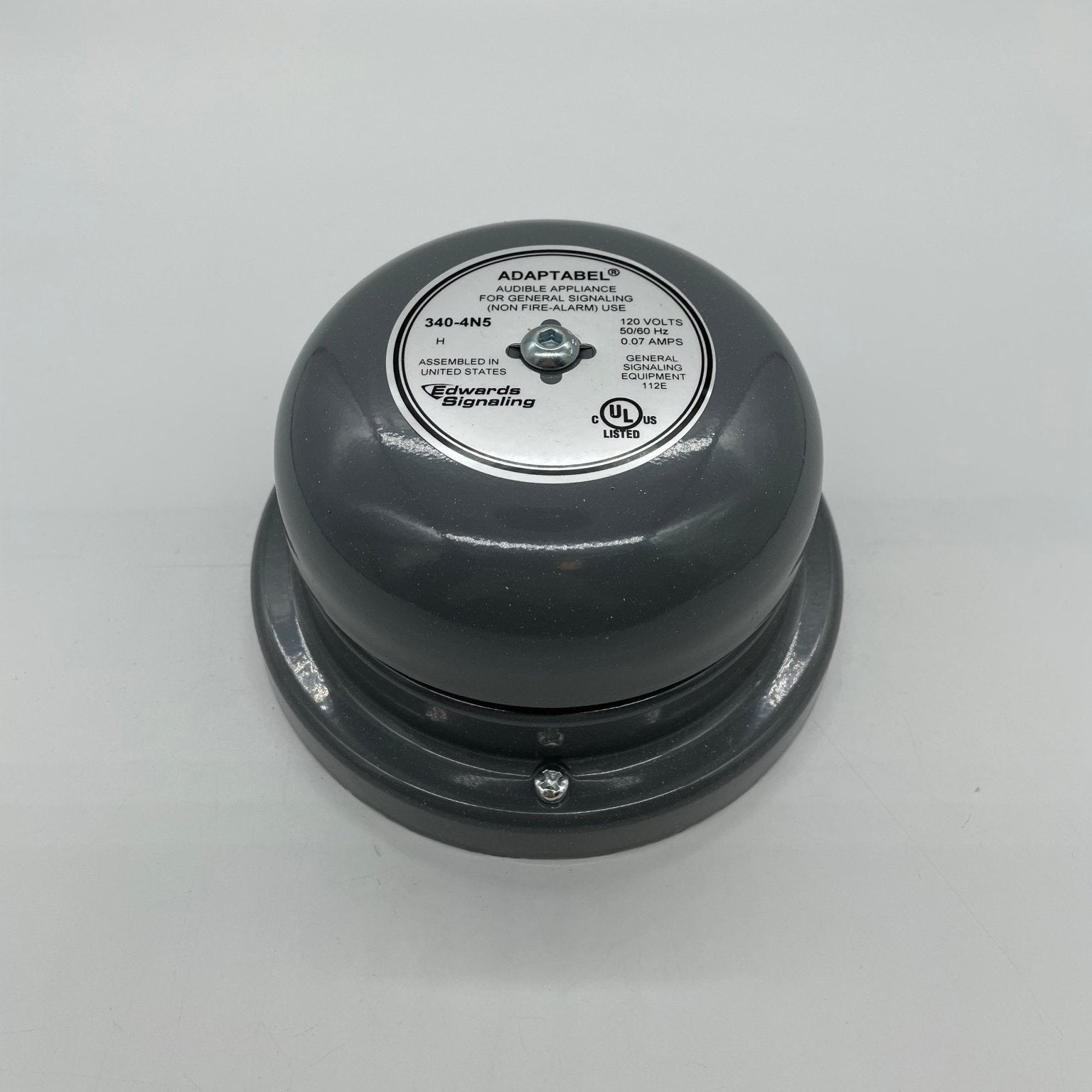 Edwards 340-4N5 4-inch AC bell, brass bell with a clapper inside, mounted on a wooden base, for fire alarm systems.