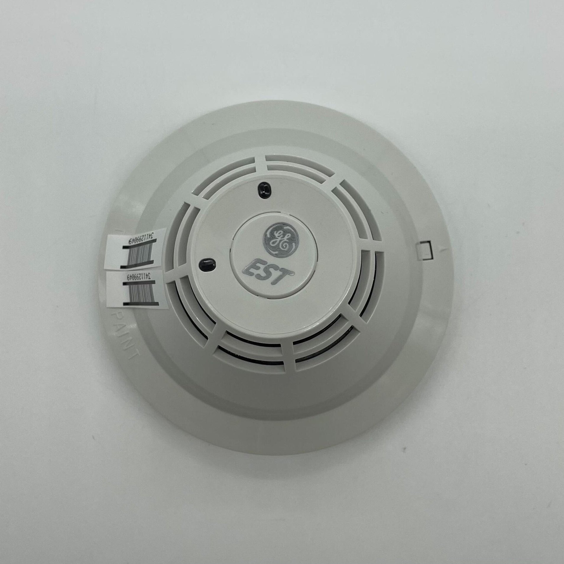 Edwards SIGA-PHS Intelligent 3D multisensor photoelectric heat detector mounted on ceiling, designed for fire detection.