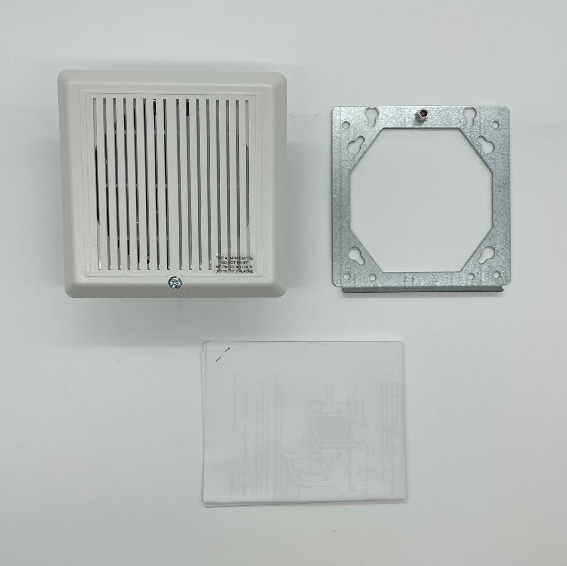 White Edwards 757-1A-S70W 70V cone-type speaker for audio installations, showing the front view of the speaker with grille and branding.