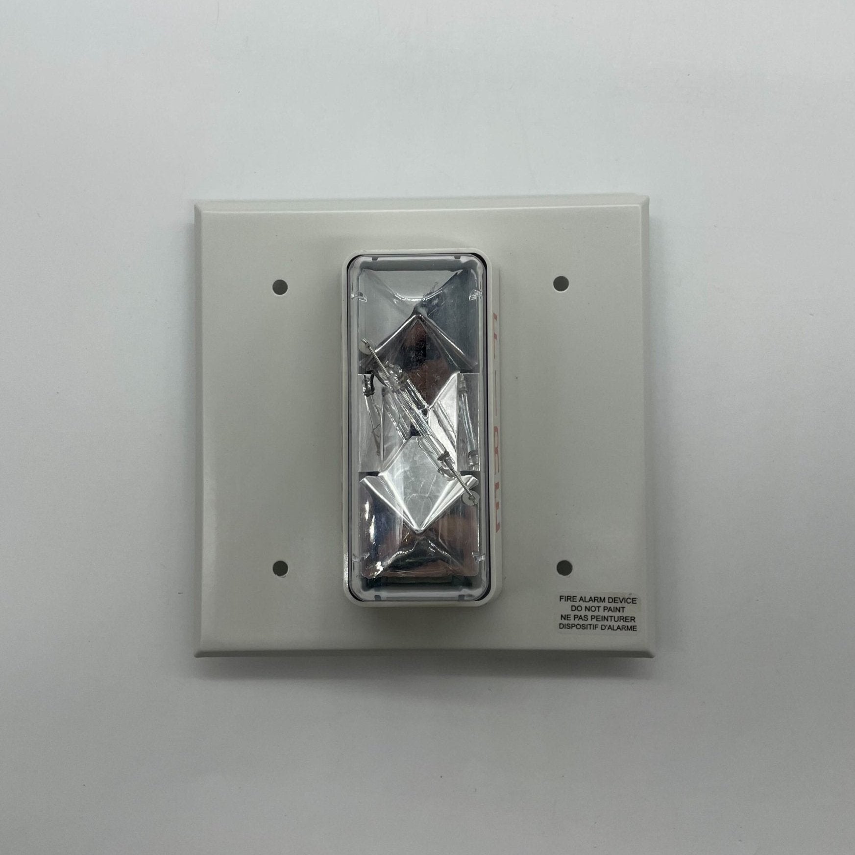 Edwards 405-7A-TW strobe light with blue warning lens mounted on industrial equipment, showcasing safety signaling.