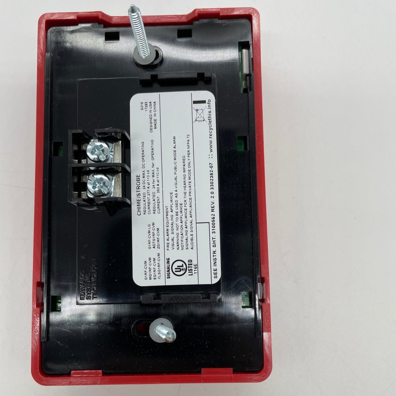 Edwards G1RF-CVM strobe light with bright flashing LED, mounted on a industrial fixture for visual signaling and safety.
