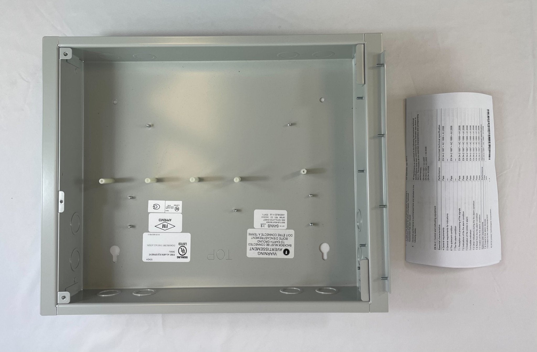 Edwards 6ANN/B six-position LED/LCD wall box mounted on wall with multiple switch positions and display panel