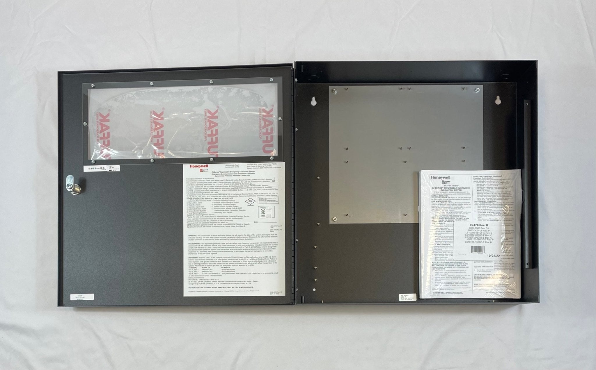 Gamewell-FCI E3BB-BB enclosure cabinet, LOC B size, used for fire alarm system components and wiring, black metal construction.