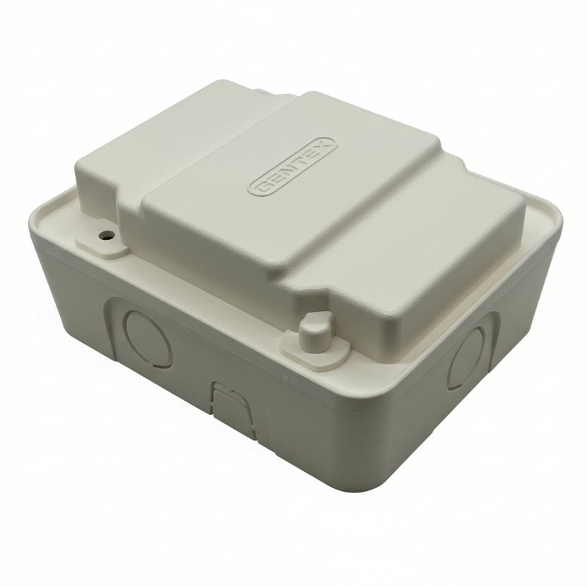 Gentex GTSM-W synchronization module for vehicle systems, shown in a close-up view with connectors and circuit board details.
