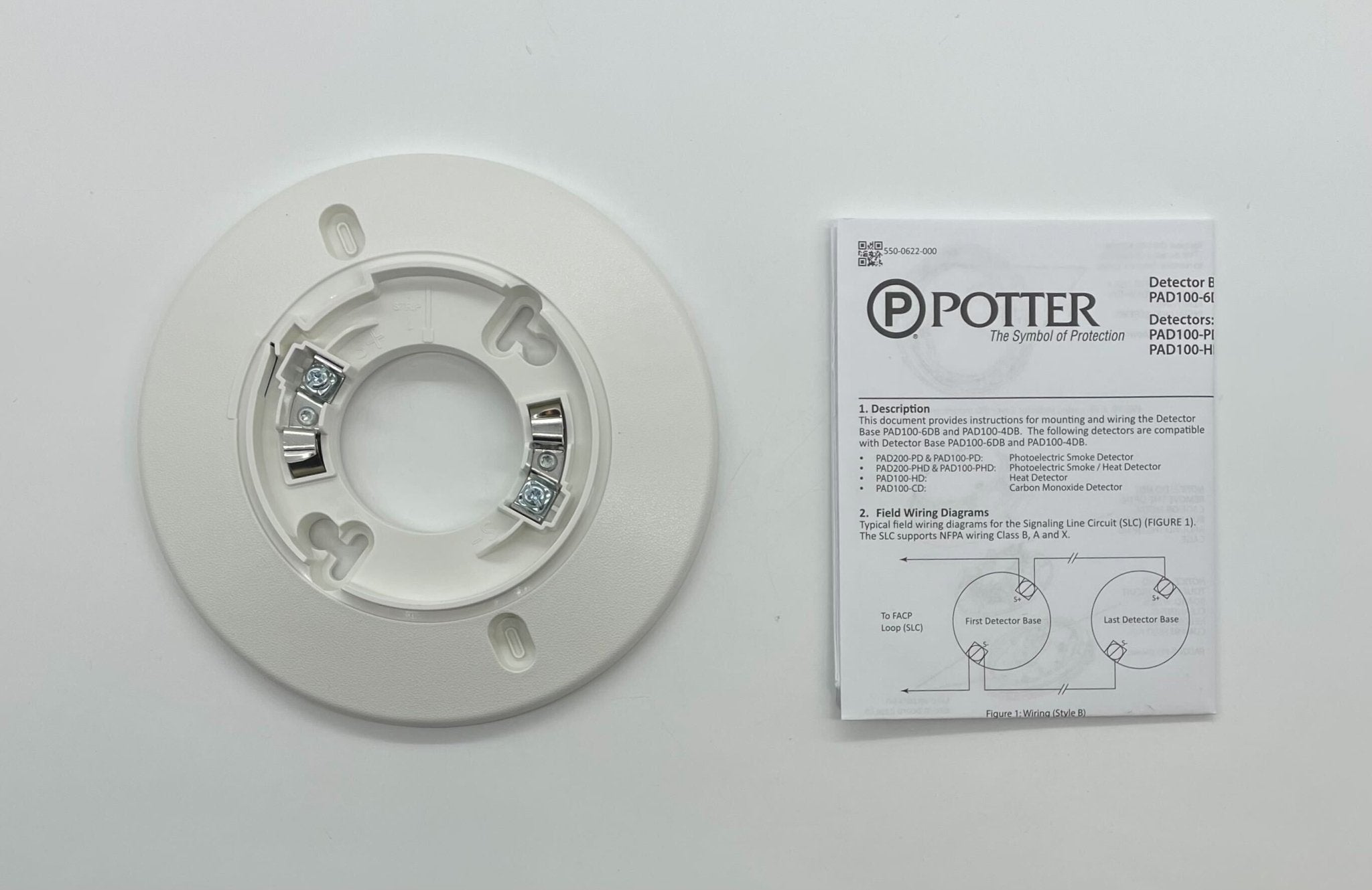 Potter PAD100-6DB 6-inch addressable detector base mounted on a ceiling, designed for fire alarm systems.