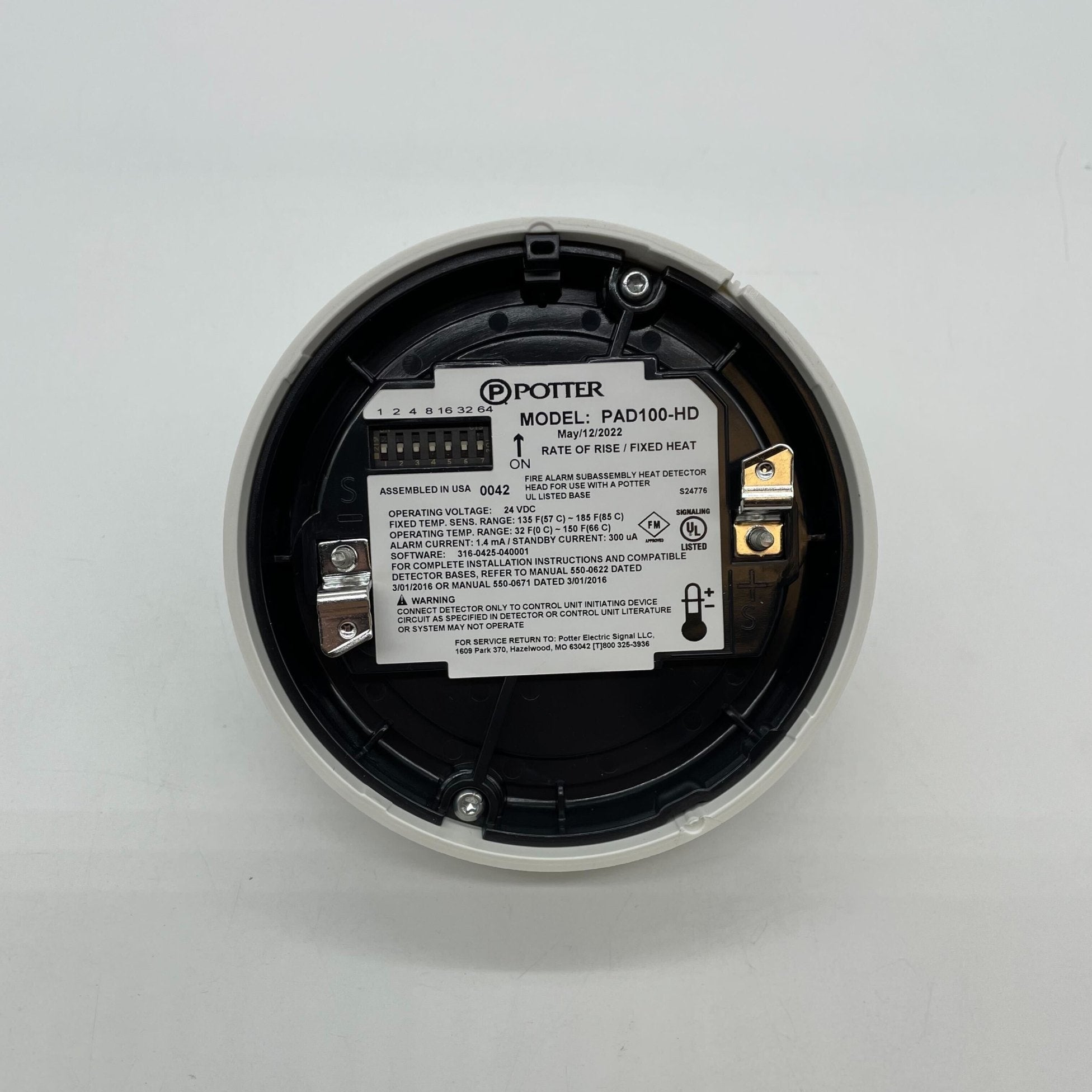 Potter PAD100-HD rate of rise fixed temperature heat detector showing sensor with wiring and mounting base.