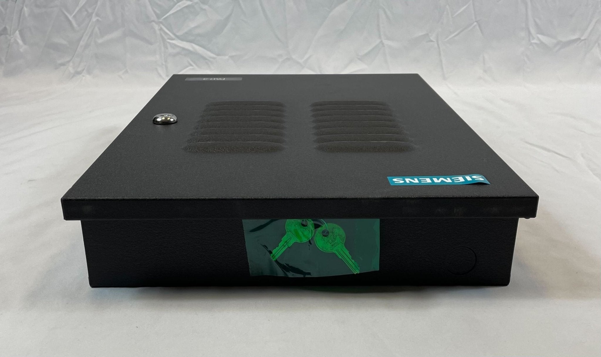 Black Siemens EN-PAD enclosure for PAD-3 fire alarm system, protective plastic cover with secure mounting features.