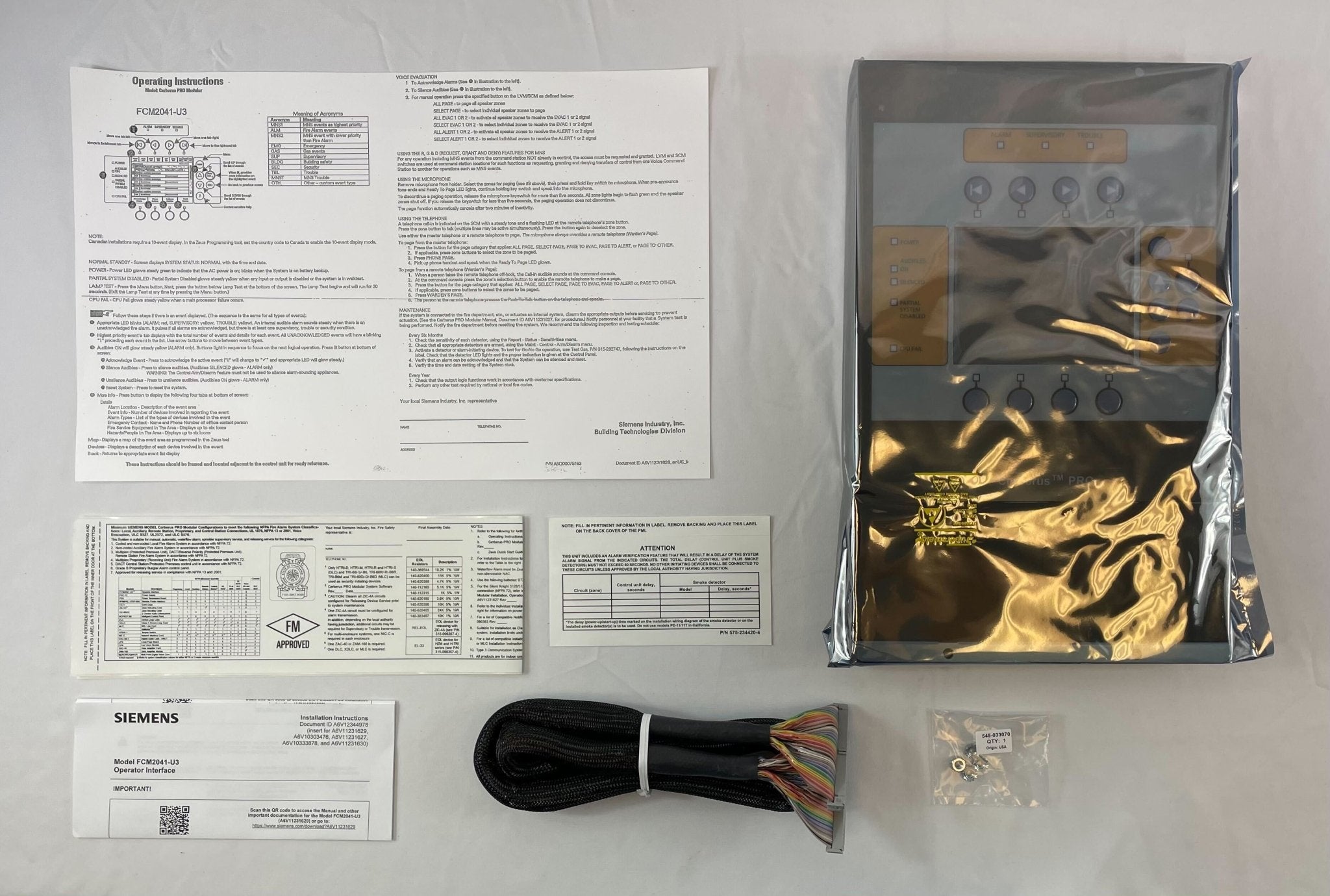 Siemens Cerberus FCM2041-U3 fire alarm operator interface panel with display and control buttons for fire safety management.