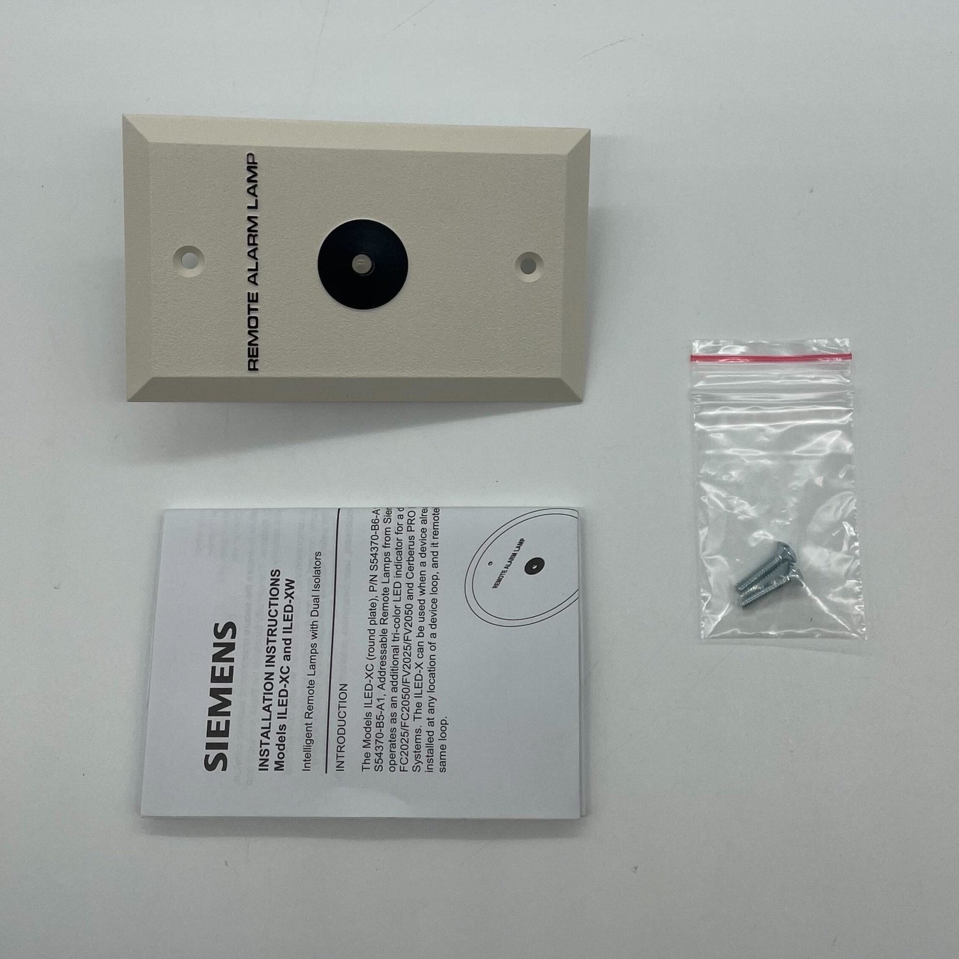 Siemens ILED-XW (S54370-B5-A1) intelligent fire alarm lamp with warning indicator and sleek design, mounted on a wall.
