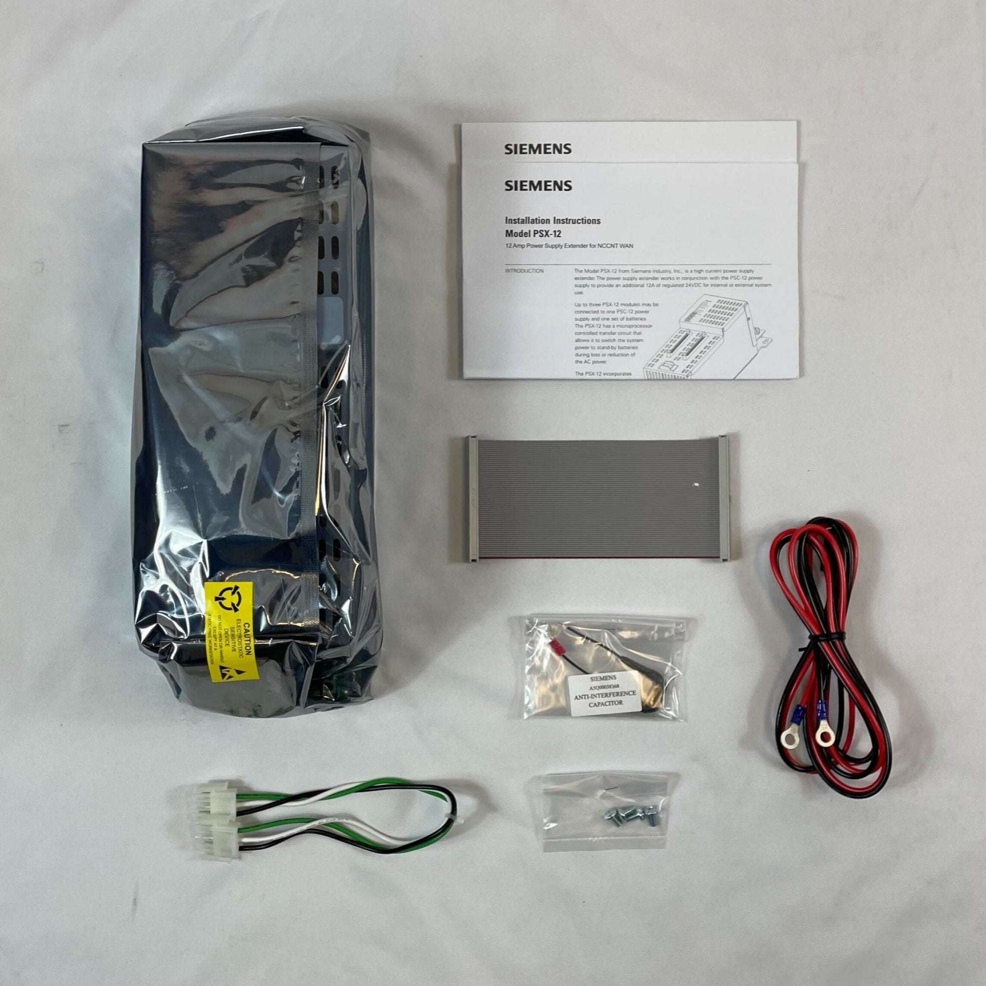 Siemens PSX-12 12A power supply extender, compact device with connection ports, designed for reliable power extension.