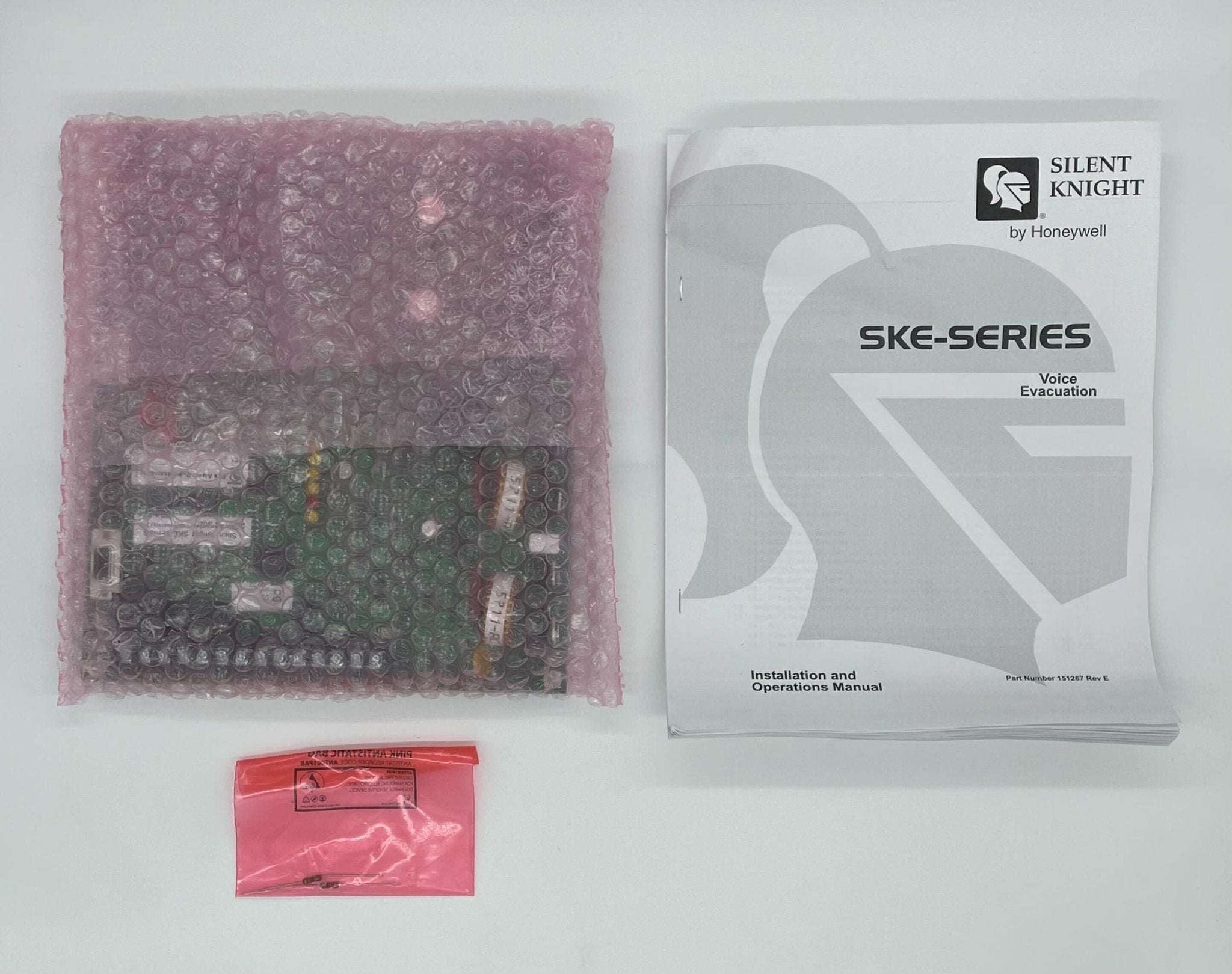 Silent Knight SKE-B450 Voice EVAC 50-Watt Board showing circuit connections and controls on a black electronic board.