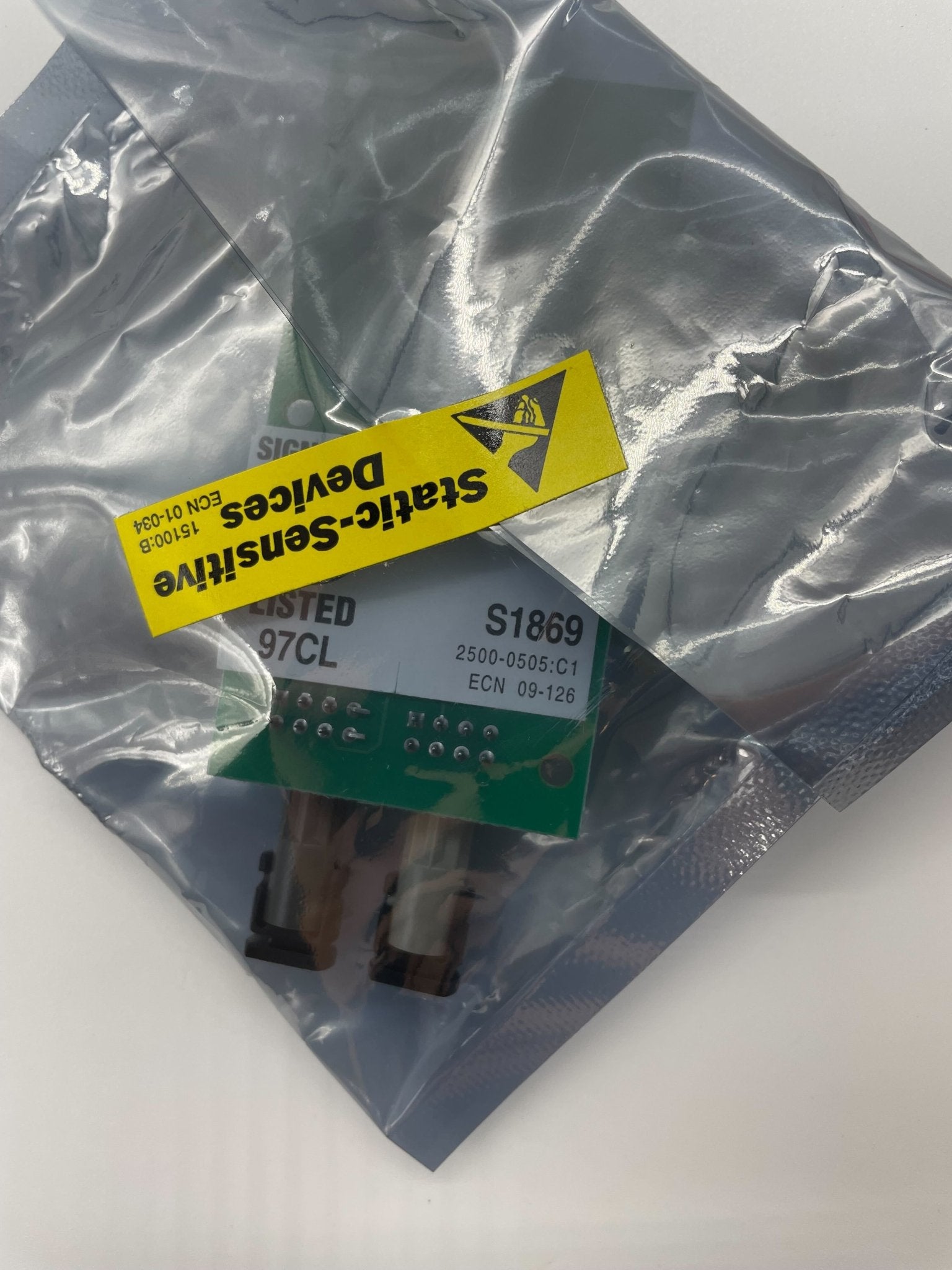 Silent Knight SK-FML plug-in fiber loop module for fire alarms, shown mounted with connection ports visible.