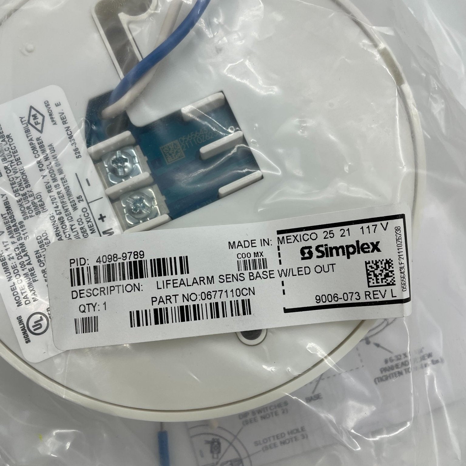 Simplex 4098-9789 sensor base, a durable plastic mounting base for security and alarm systems, with a clean, neutral background.