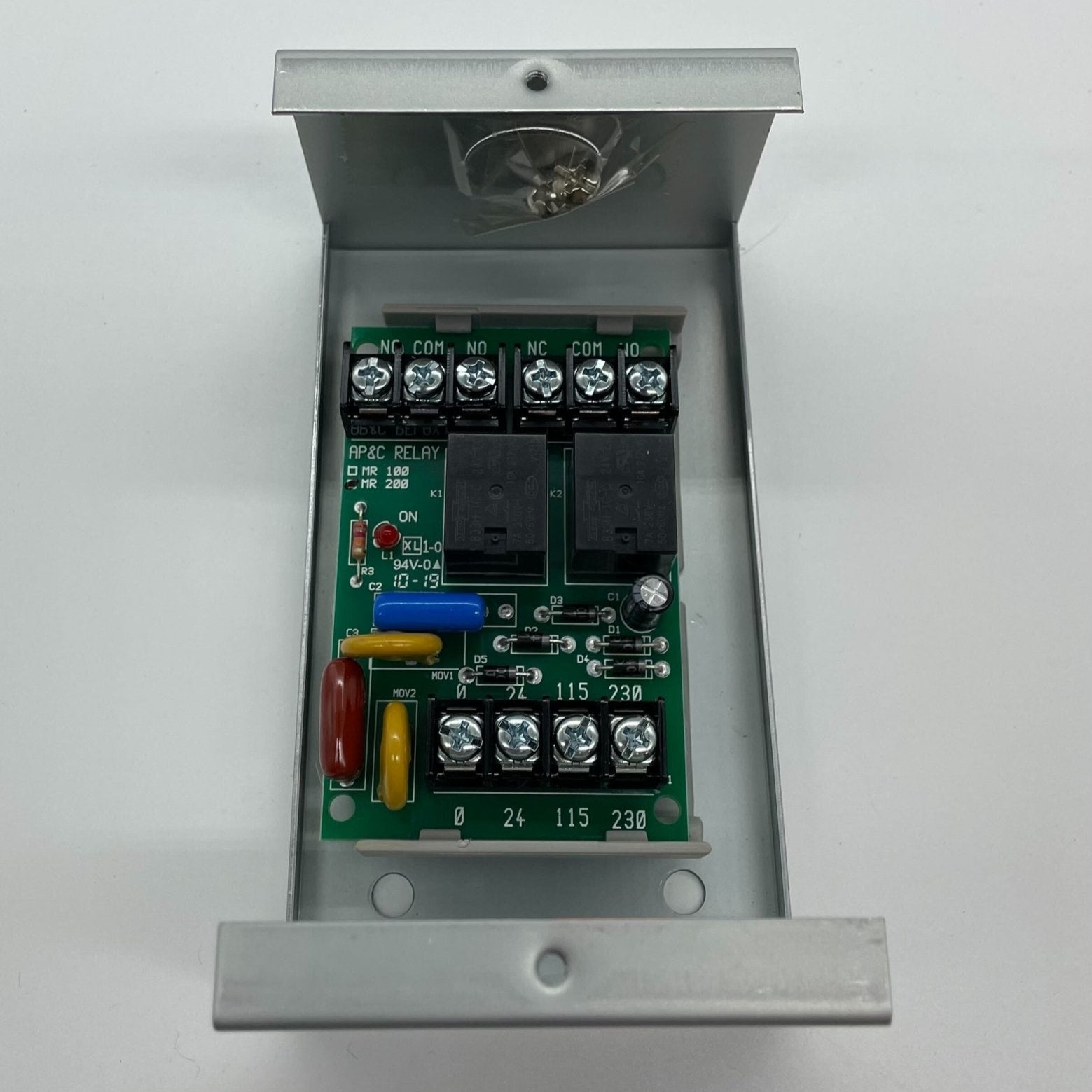 Space Age SSU-MR-201/C/R multi-voltage control relay showing terminals and control switch for industrial automation.