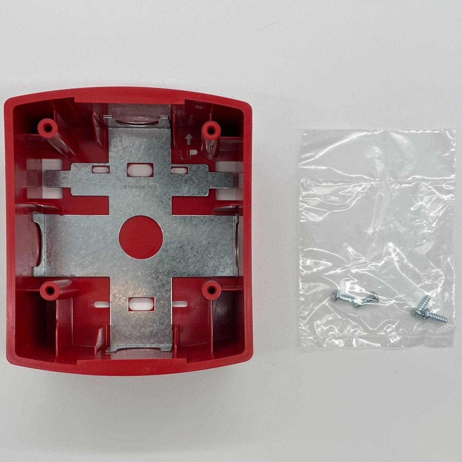 Red System Sensor wall mount back box for fire alarm systems, rectangular metal enclosure with mounting holes.