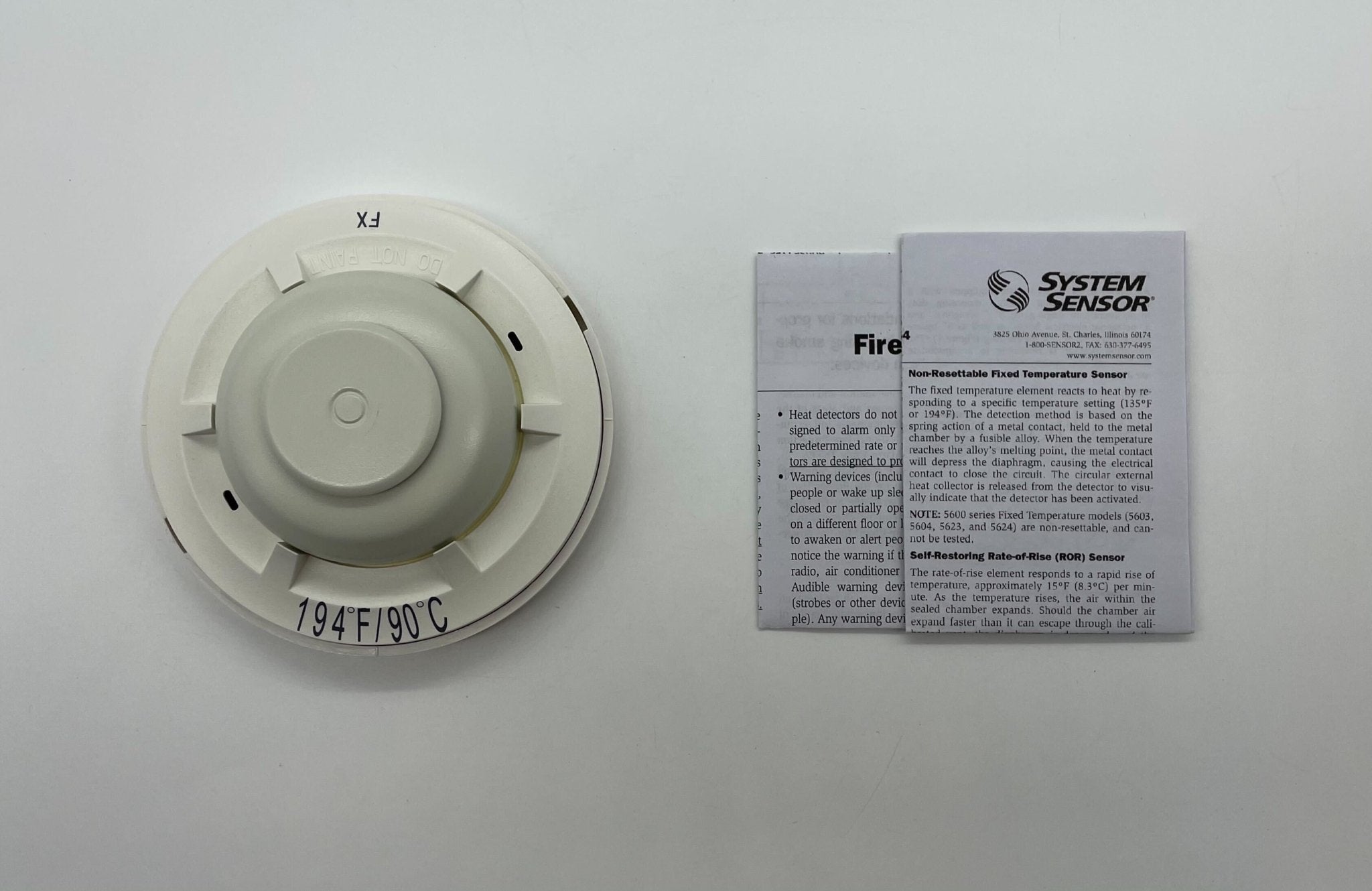 System Sensor 5624 Heat Detector showing a compact, white heat sensor device suitable for fire detection systems.