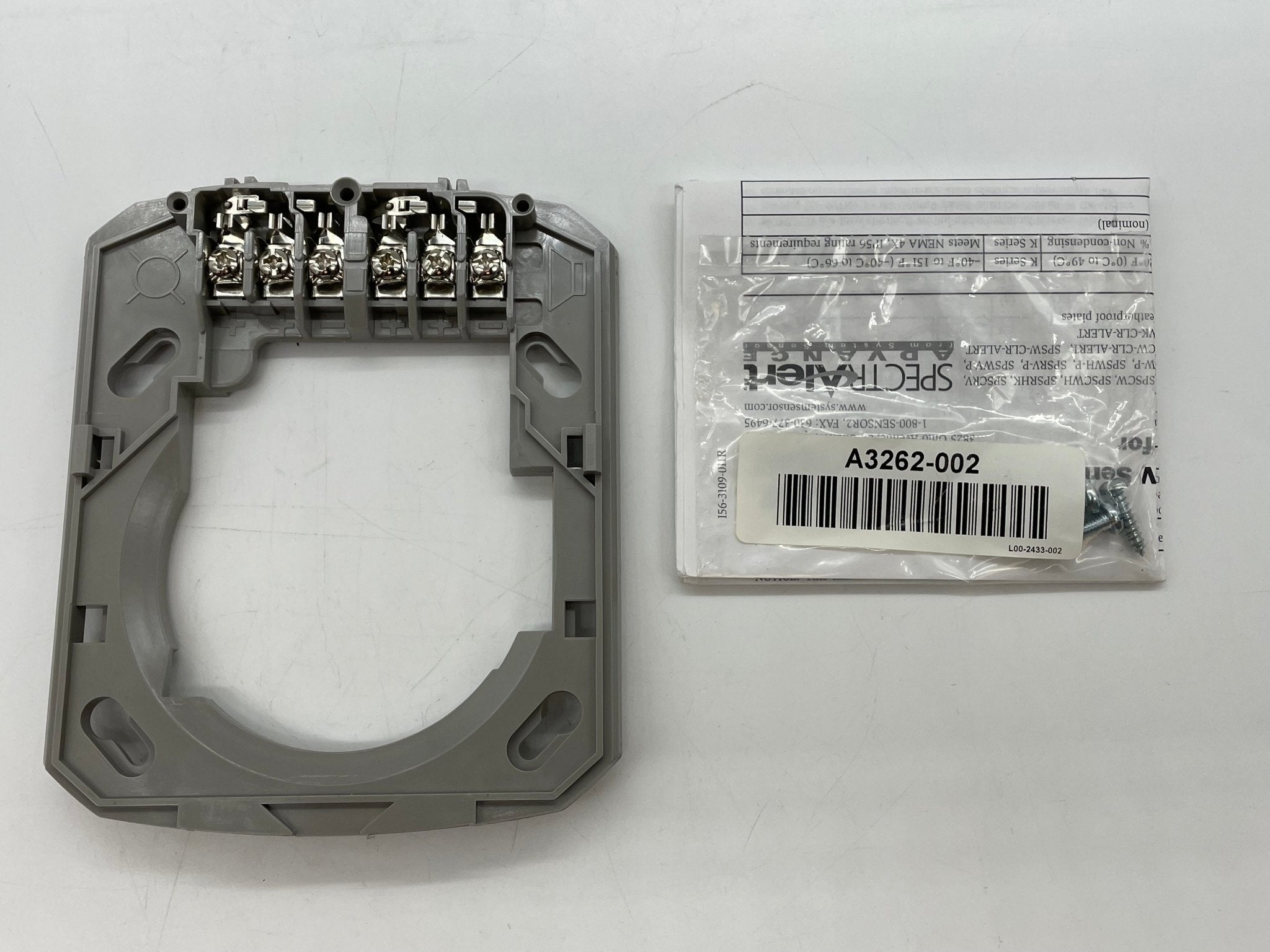 System Sensor PC4W horn strobe fire alarm device showing yellow horn and clear strobe lens on white housing
