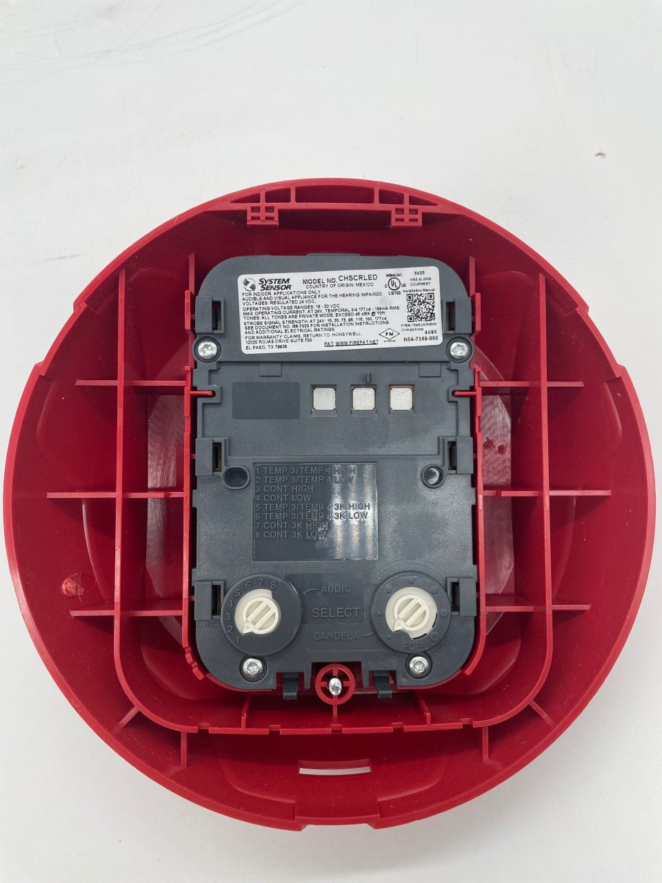 System Sensor CHSCRLED chime strobe in red, features a loud chime and bright red strobe light for alerting in fire alarm systems.
