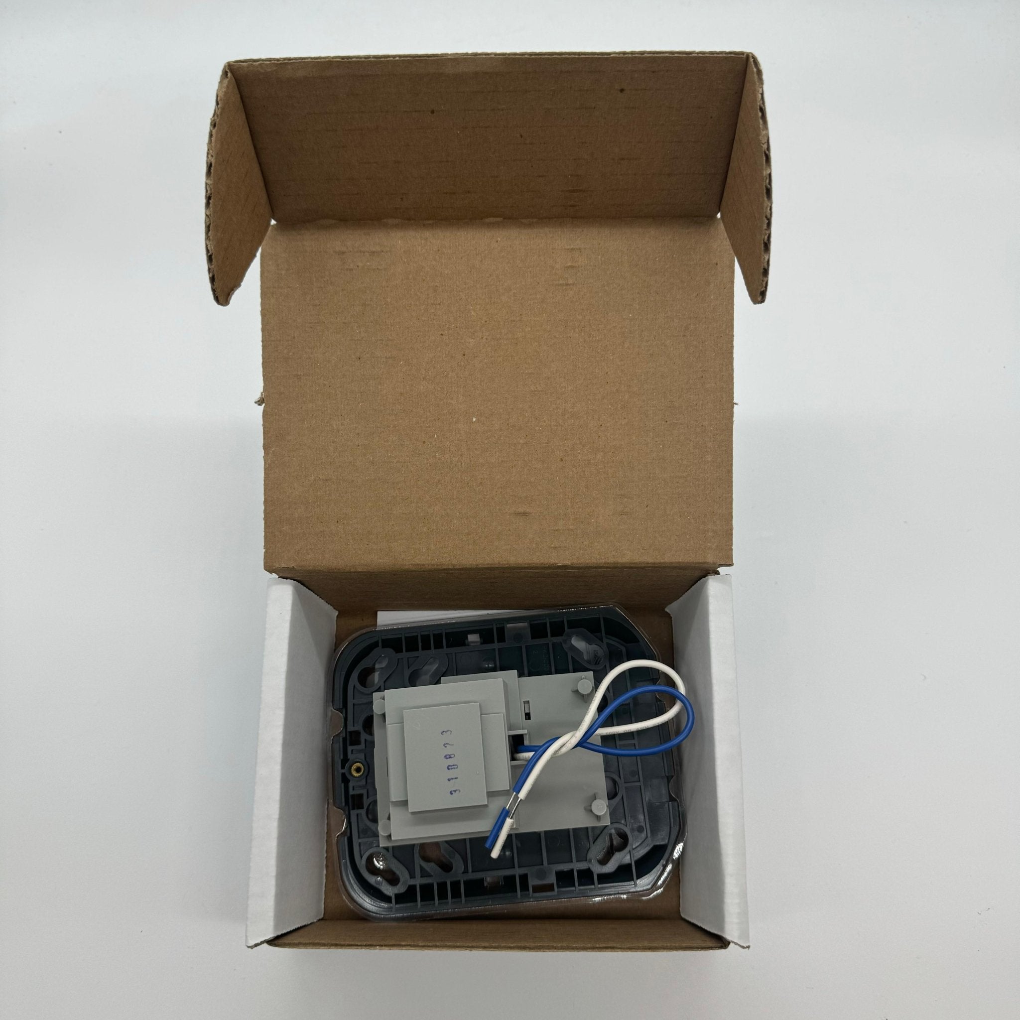 System Sensor MP120KL 120VAC adapter mounting plate mounted on a wall for easy installation of sensors.
