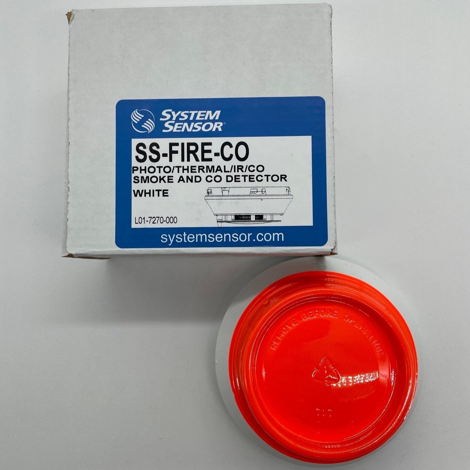 System Sensor SS-FIRE-CO multi-criteria fire and carbon monoxide detector mounted on a ceiling, detecting smoke and CO levels.