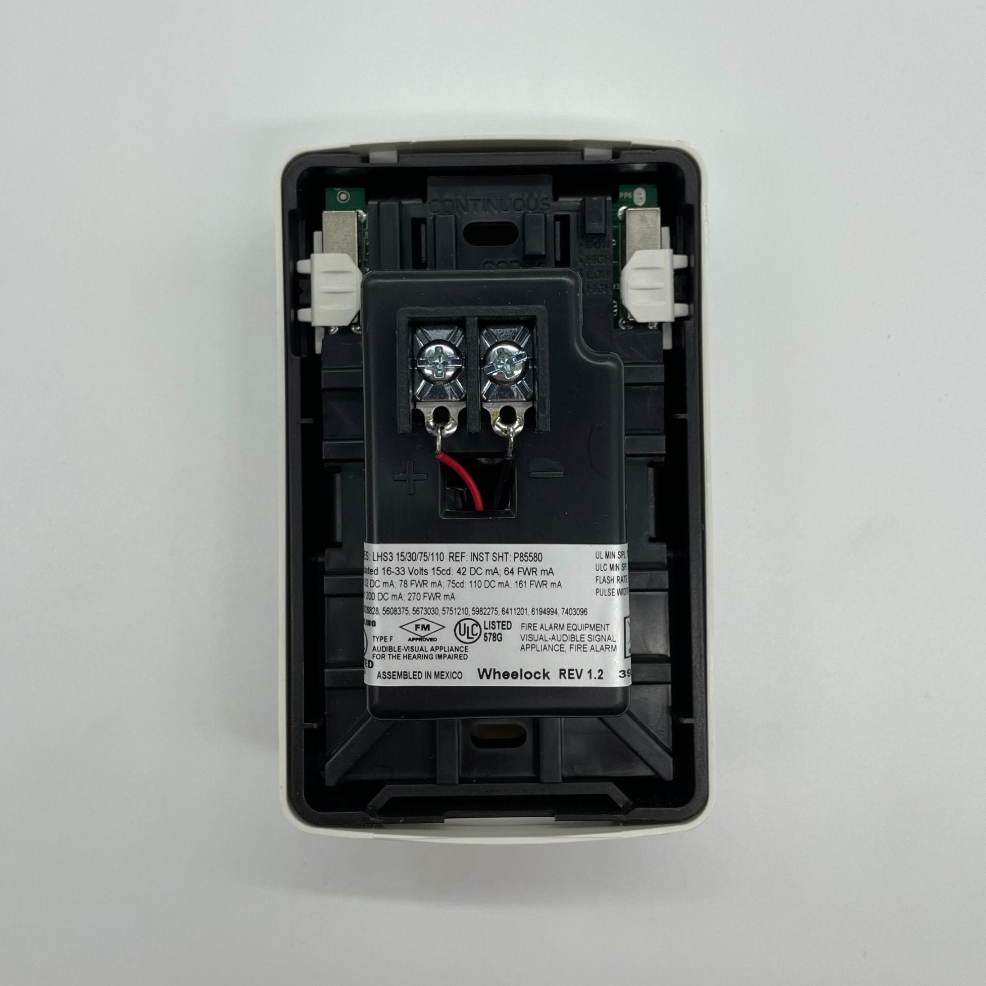 Eaton Wheelock Exceder LED3 horn strobe with red housing and mounting bracket, designed for fire alarm notification systems.