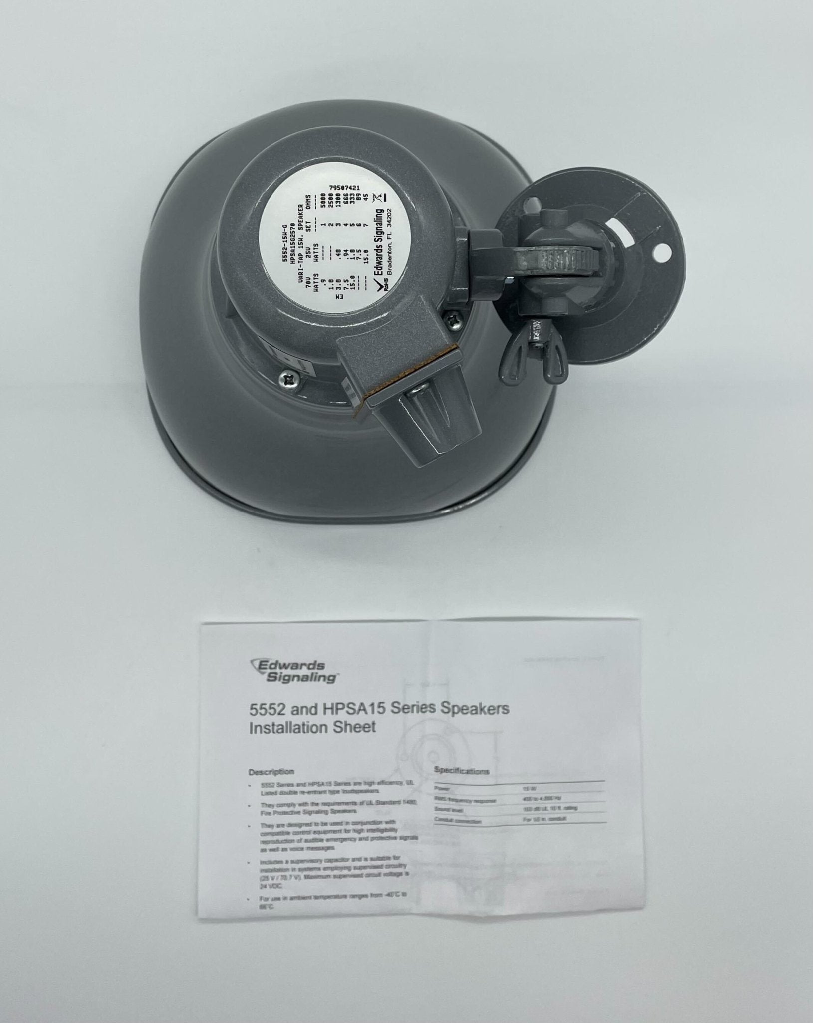 Edwards HPSA15G2570 15-watt loudspeaker showing a compact black speaker with mounting bracket and connection terminals.