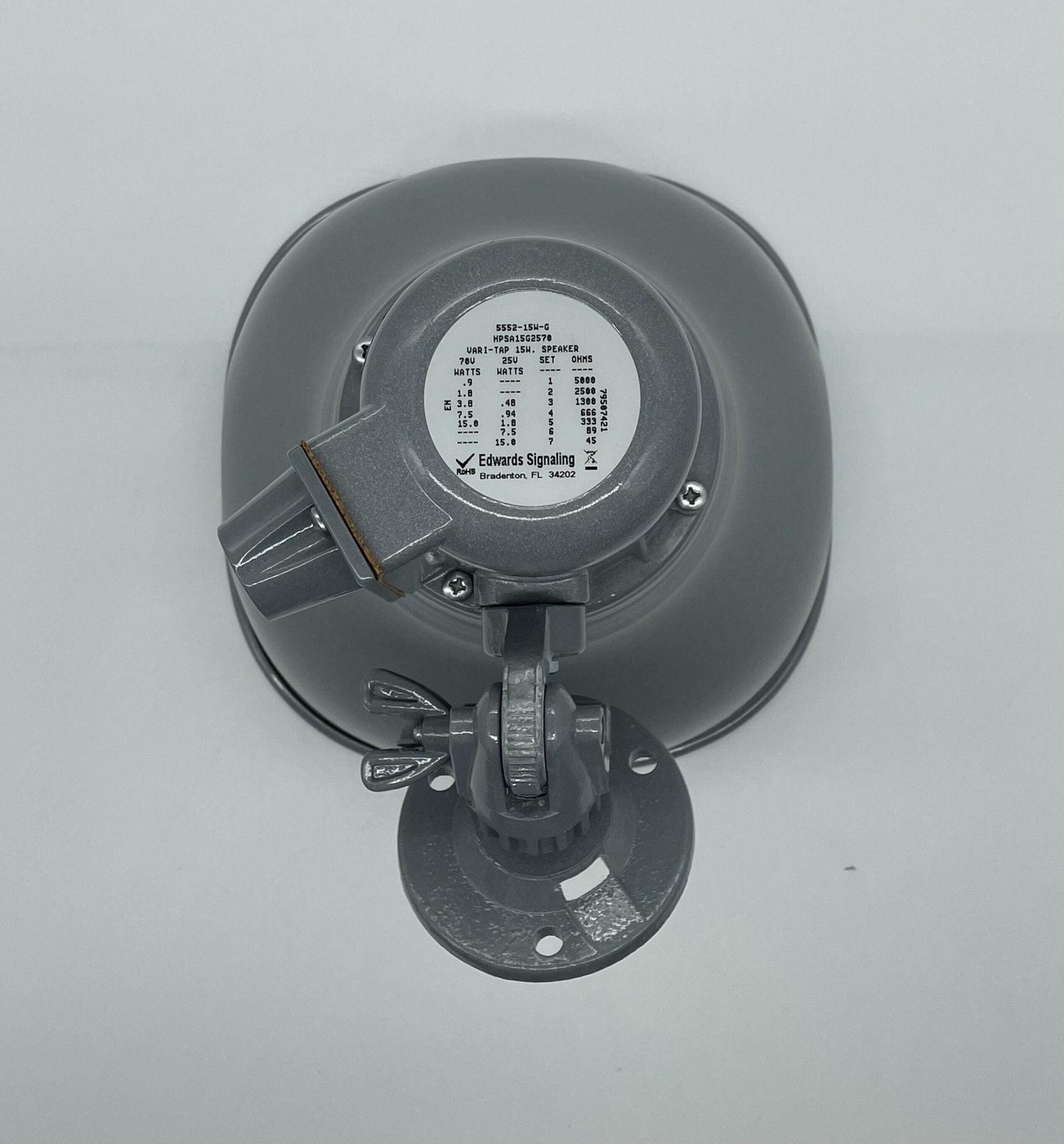 Edwards HPSA15G2570 15-watt loudspeaker mounted on a wall, showing its compact design and speaker grille for clear sound output.