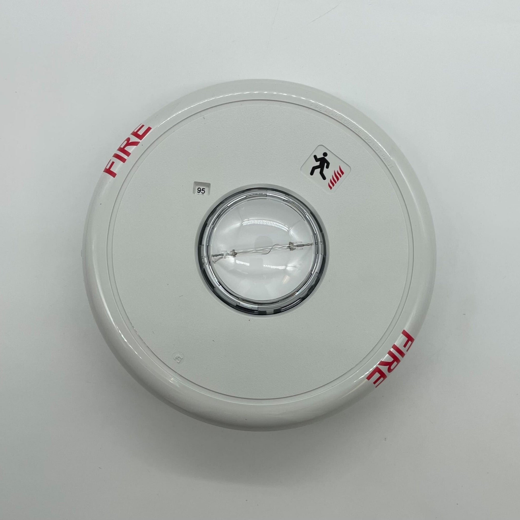 Edwards Genesis GCF-VMH ceiling strobe light with clear lens and mounting bracket, designed for emergency signaling.
