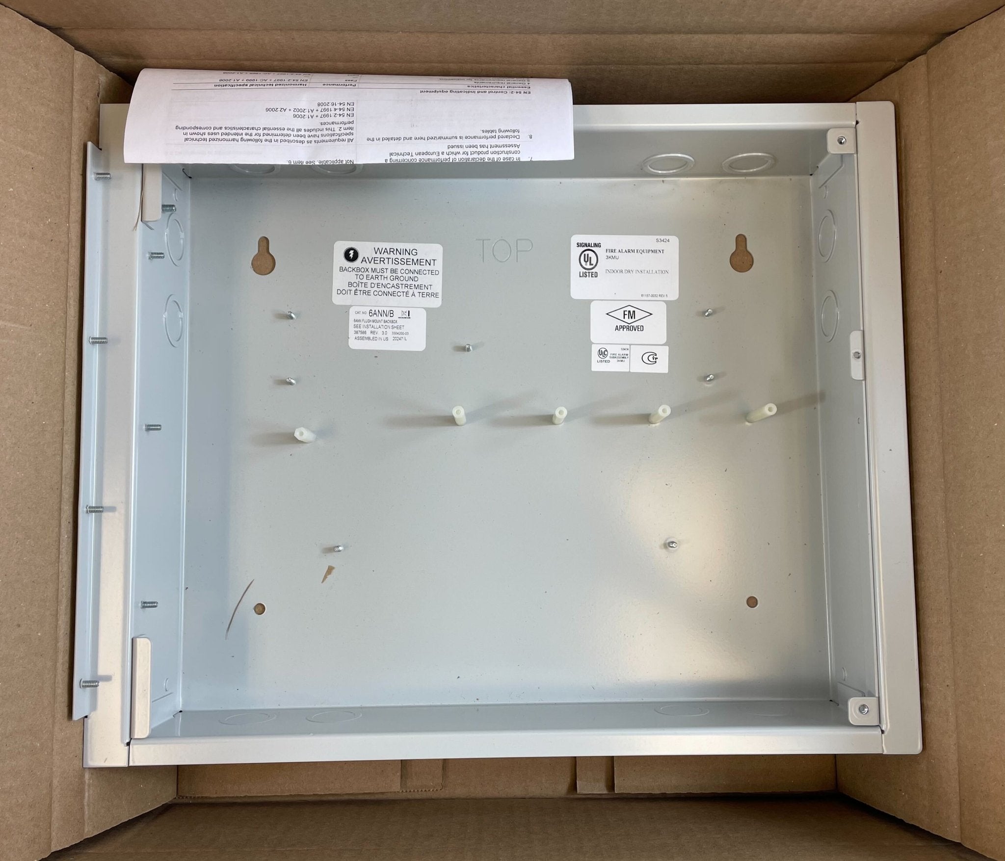 Edwards 6ANN/B six-position LED/LCD wall box for electrical control and display, mounted on a wall with visible wiring.