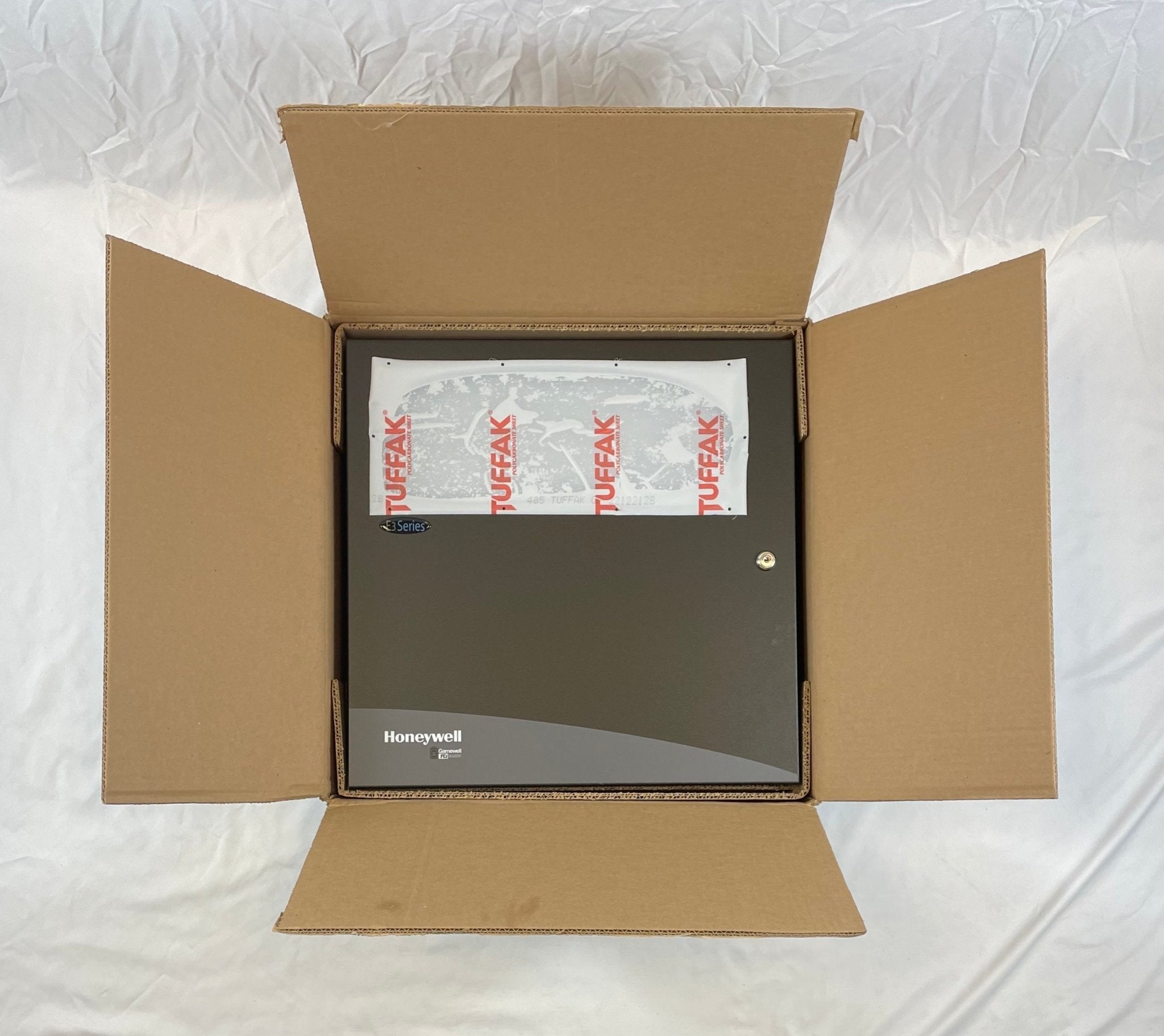 Gamewell-FCI E3BB-BB enclosure cabinet, LOC B size, metal fire alarm control panel housing with lockable door and ventilation slots.
