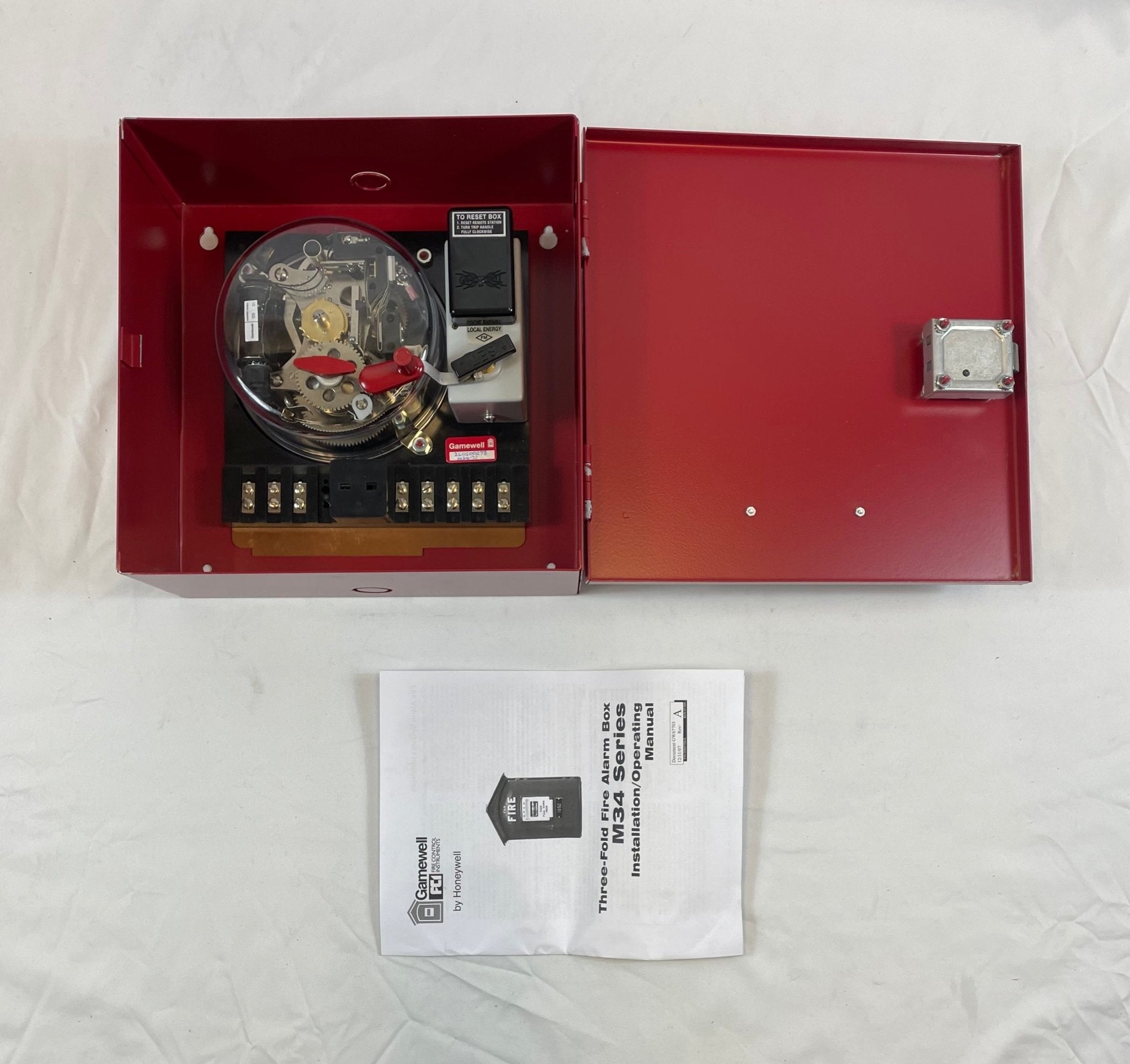 Gamewell-FCI GWM34-72 local energy trip power supply, compact safety device for fire alarm systems, with visible wiring connection.
