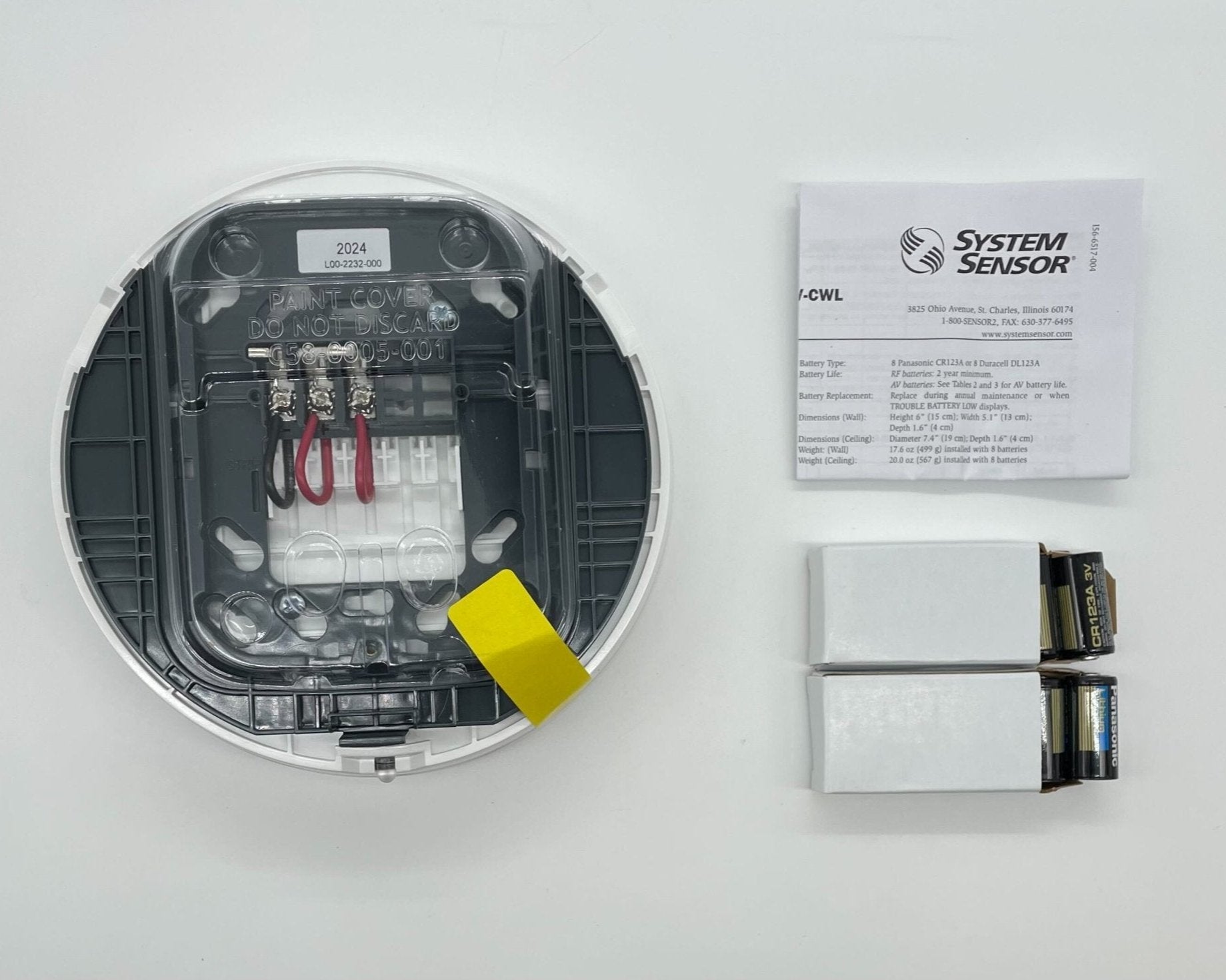 System Sensor WAV-CWL Wireless AV Base mounted on ceiling, designed for alarm system installation and wireless connectivity.