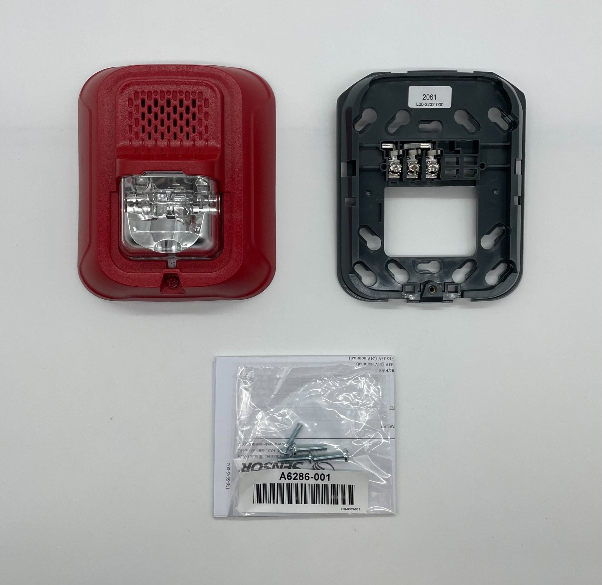 System Sensor P2RL-P horn strobe alarm with red housing and clear lens, mounted on wall for fire safety alert.