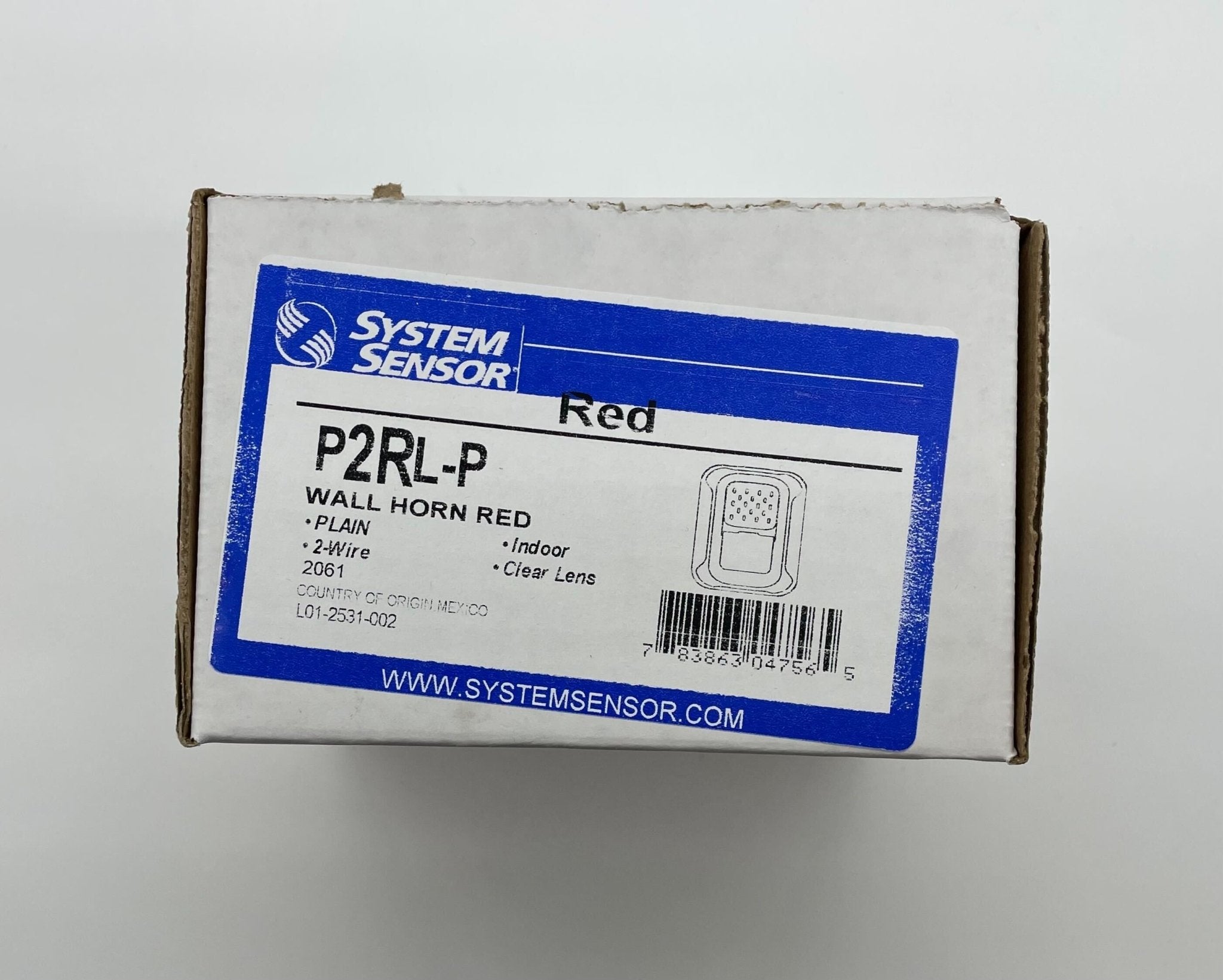 System Sensor P2RL-P horn strobe with red housing, visible mounting hardware, and clear lens for fire alarm signaling.