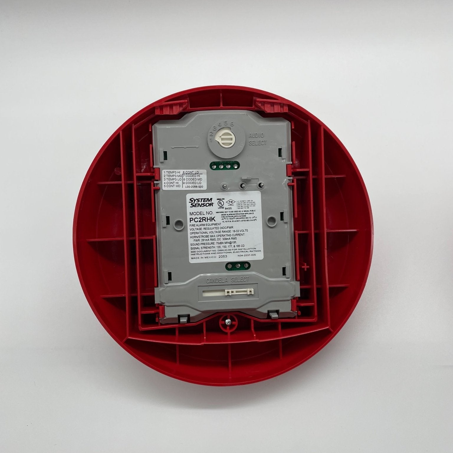 System Sensor PC2RHK outdoor horn strobe with selectable output, mounted on exterior wall for fire alarm signaling.