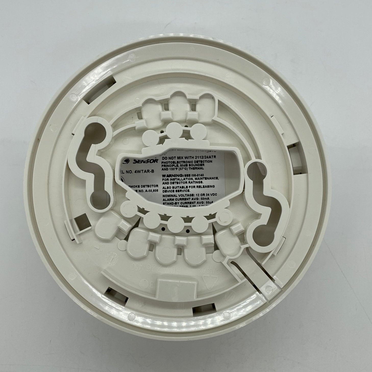 System Sensor 4WTAR-B smoke detector and thermal sensor mounted on ceiling, featuring dual detection components for fire safety.
