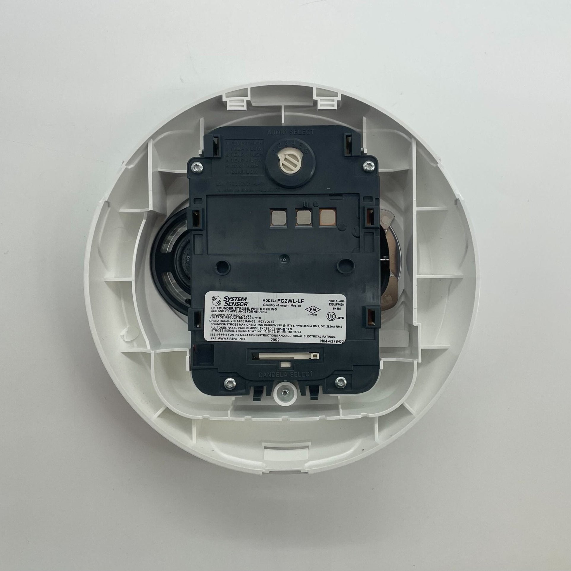 System Sensor PC2WL-LF L-Series low frequency sounder strobe with red housing and mounting bracket, designed for alarm notifications.