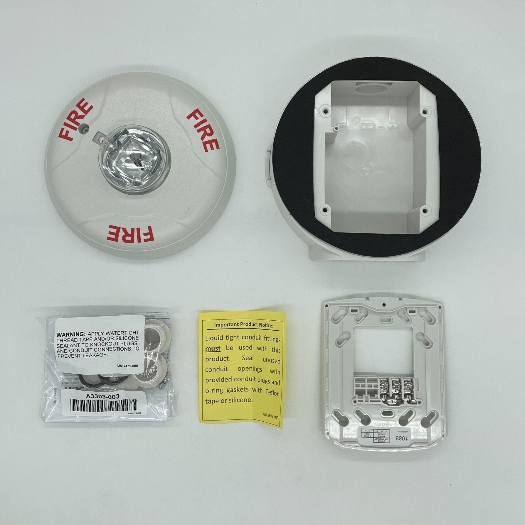 White outdoor strobe light from System Sensor, model SCWHK, designed for alert signaling and safety applications.